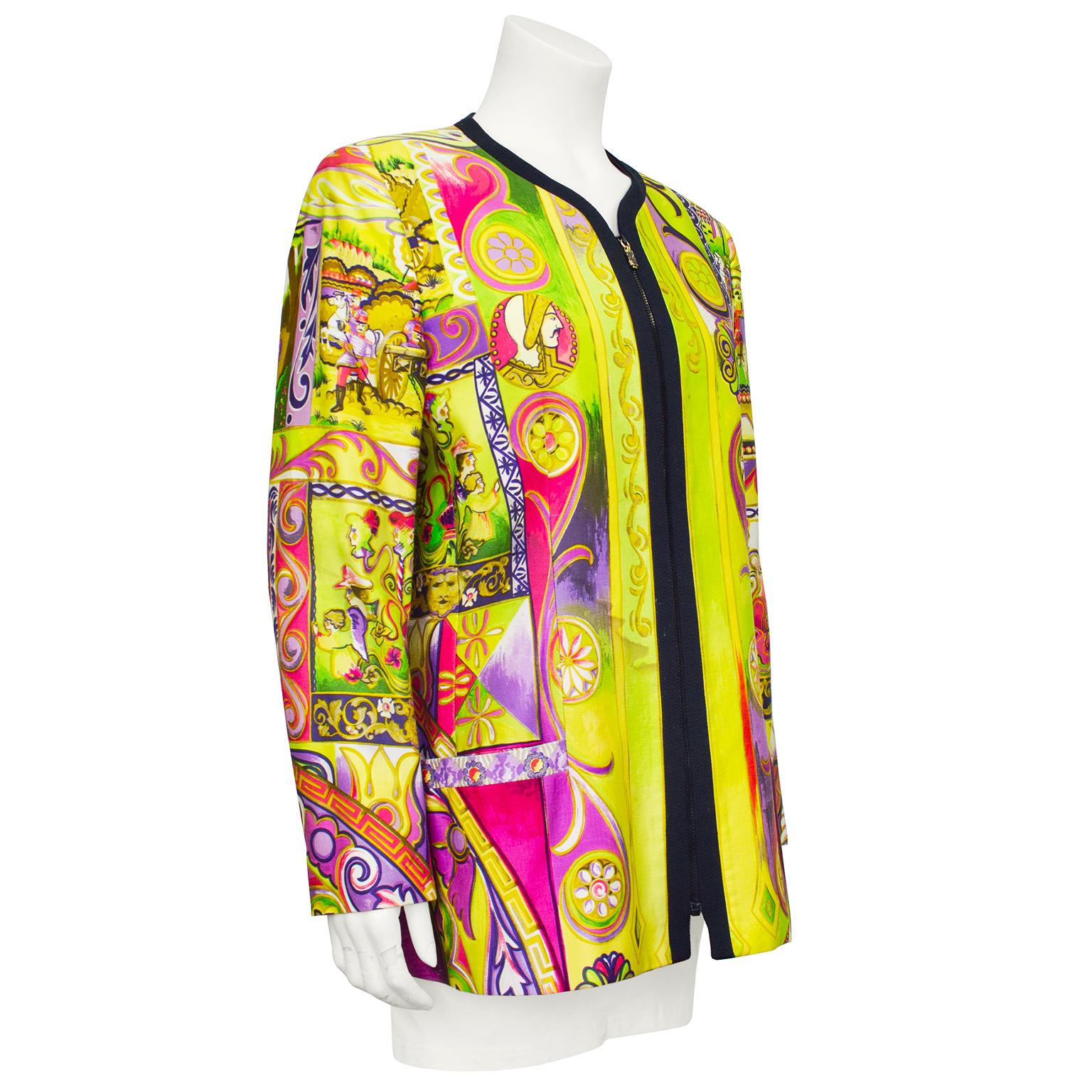 Early 1990s Gianni Versace Couture black label cotton jacket. Shades of yellows, greens, pinks and purples in an all over baroque print. Collarless with black trim with black top stitching and black zipper up centre front. Lime green lining &