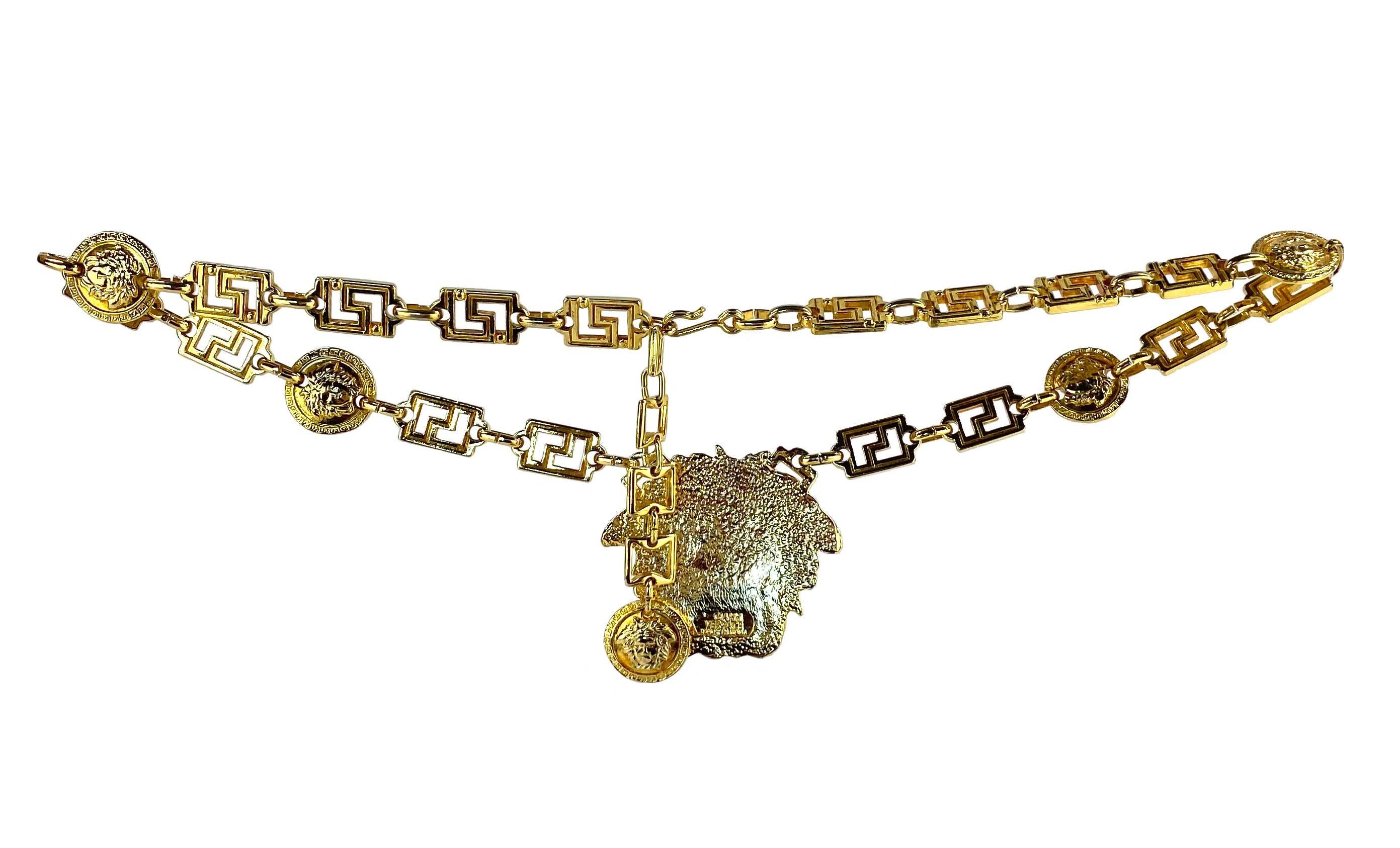 Presenting a stunning gold Medusa Greek key Gianni Versace chain belt/necklace, designed by Gianni Versace. This stunning belt is constructed of gold colored metal and features a Greek key chain with Versace Medusa medallions. Front and center, is