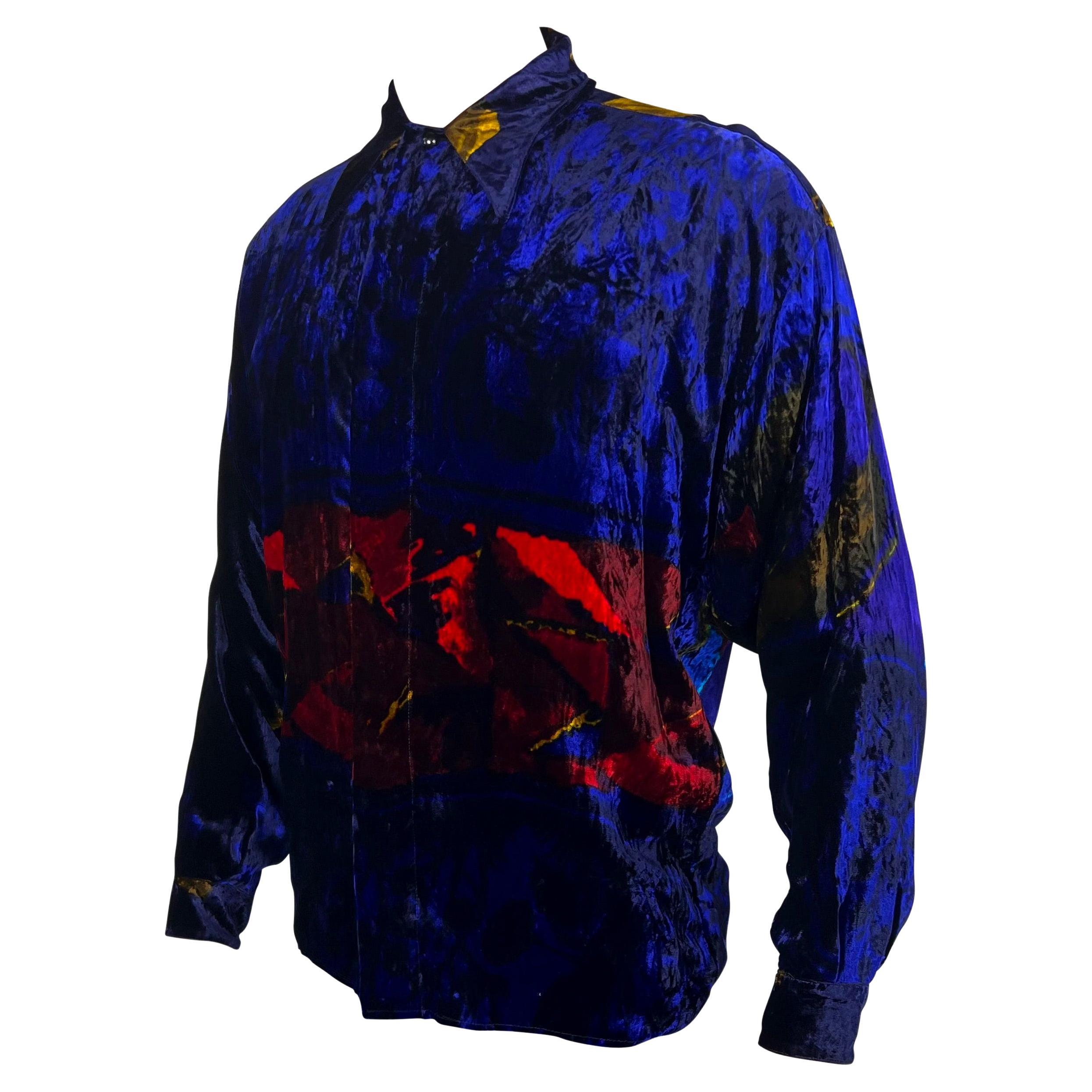 TheRealList presents: an incredible men's abstract velvet Gianni Versace shirt, designed by Gianni Versace. From the early 1990s, this amazing and soft shirt features a blue and red abstract print throughout. This bold shirt is made complete with a