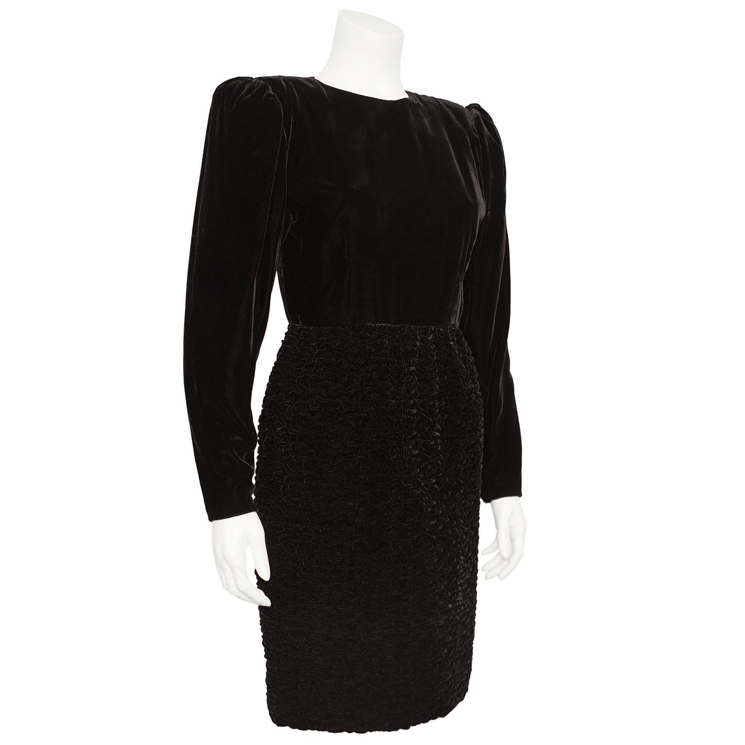 Early 1990s Oscar de la Renta dark brown velvet long sleeve dress with Perisan Lamb style velvet skirt. The puff sleeves have shoulder pads to hold their shape and the smooth velvet ends at the natural waist. The knee length velvet skirt has a