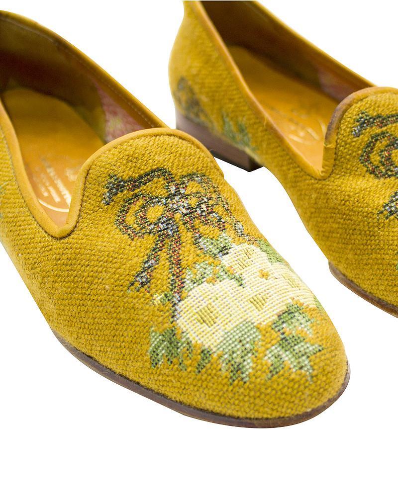 A spray of white needlepoint flowers on a golden background make these Stubbs and Wootton slip on shoes an elegant addition for the collector who knows quality. Stubbs and Wootton have remained true to their design philosophy, simply changing the