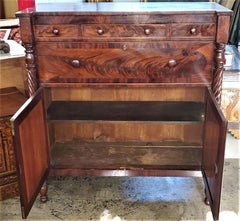Early 19th Century American Empire Flame Mahogany Cabinet