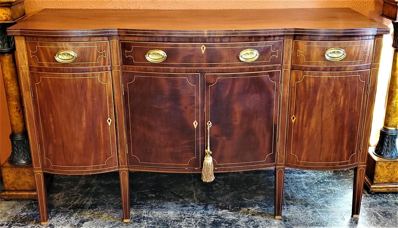 We have the pleasure to present to you a STUNNING and IMPORTANT Late 18th century American Sheraton Sideboard, made circa 1788/89, in New York by the famous Duncan Phyfe.

Signed/Marked and dated on the base of the front of the middle drawer (See