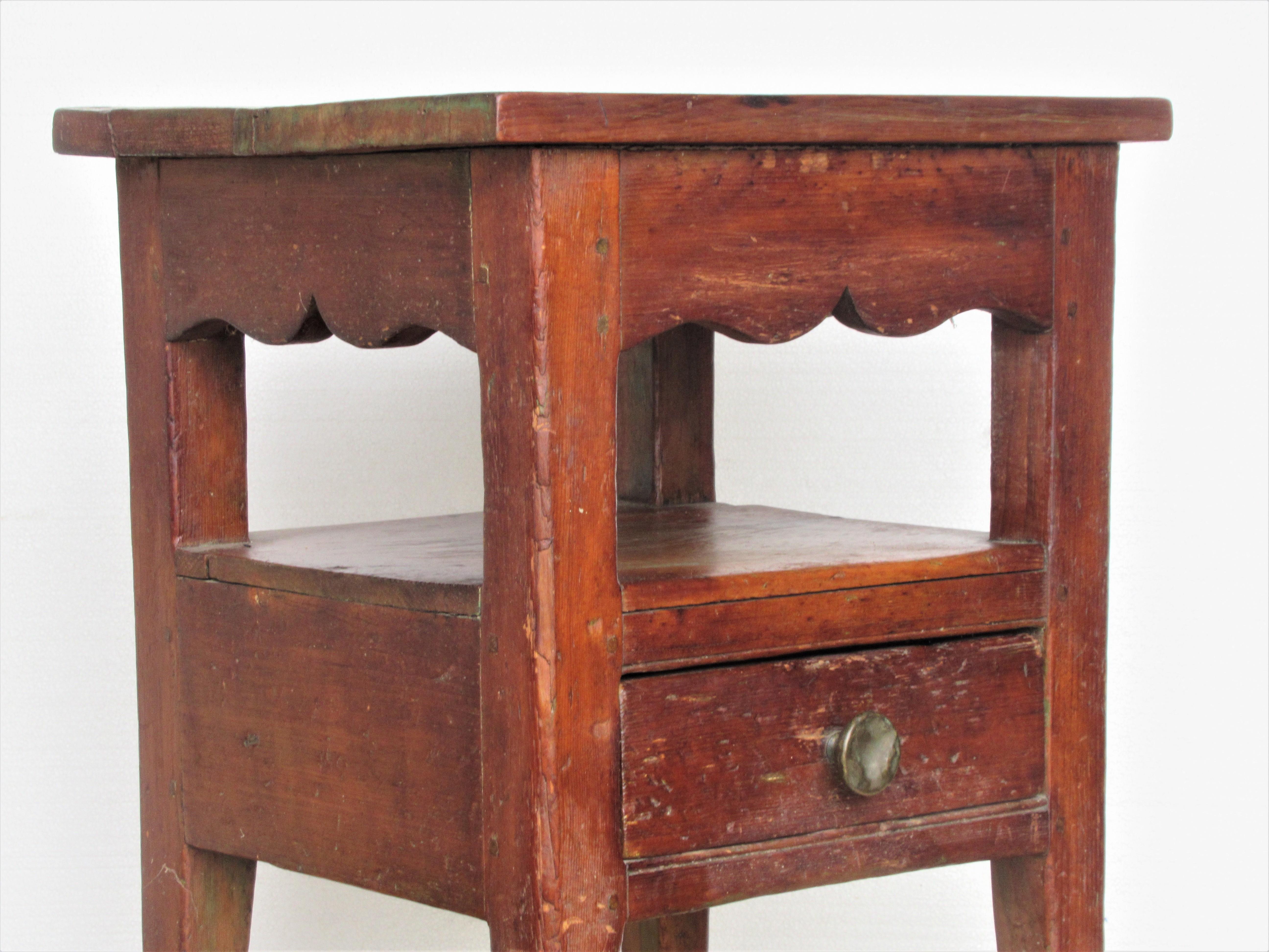 Pine one-drawer work table stand with hand forged brass iron drawer knob, scalloped rails, early pegged / dovetail construction in overall beautifully aged original old surface color. American - circa 1820. Great looking genuine old antique. Look at