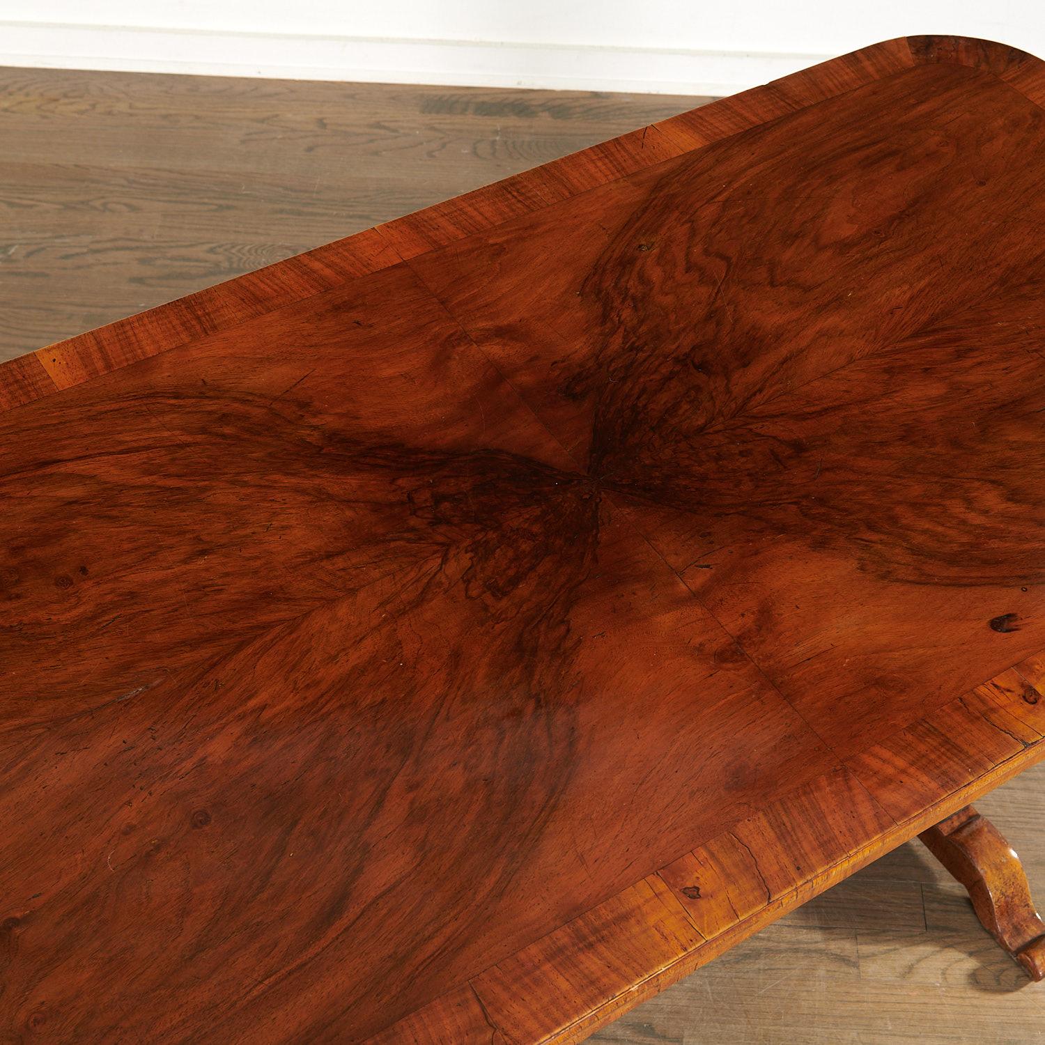 Early 19th c., Biedermeier cherrywood and banded rectangular desk/sofa table. The top is above a single drawer with center brass crest key escutcheon on lyre-form trestle base joined by a stretcher. Key is not retained. A beautifully rich patina has