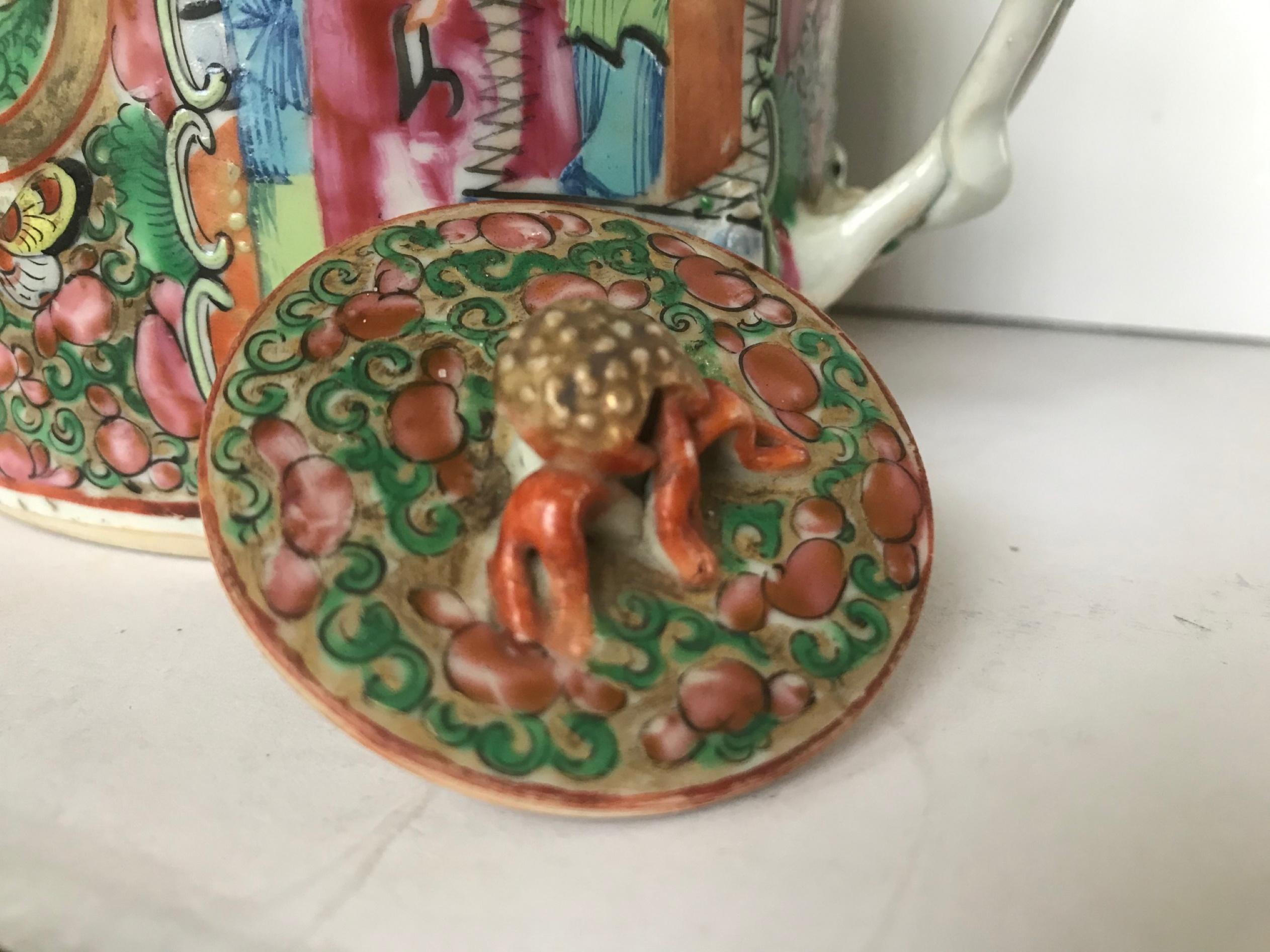 Early 19th century Chinese export rose medallion twisted branch handle porcelain teapot, Qing Dynasty

Early 19th century rose medallion drum shaped teapot with twisted branch handle. Enameled porcelain decorated with cartouches of Mandarin