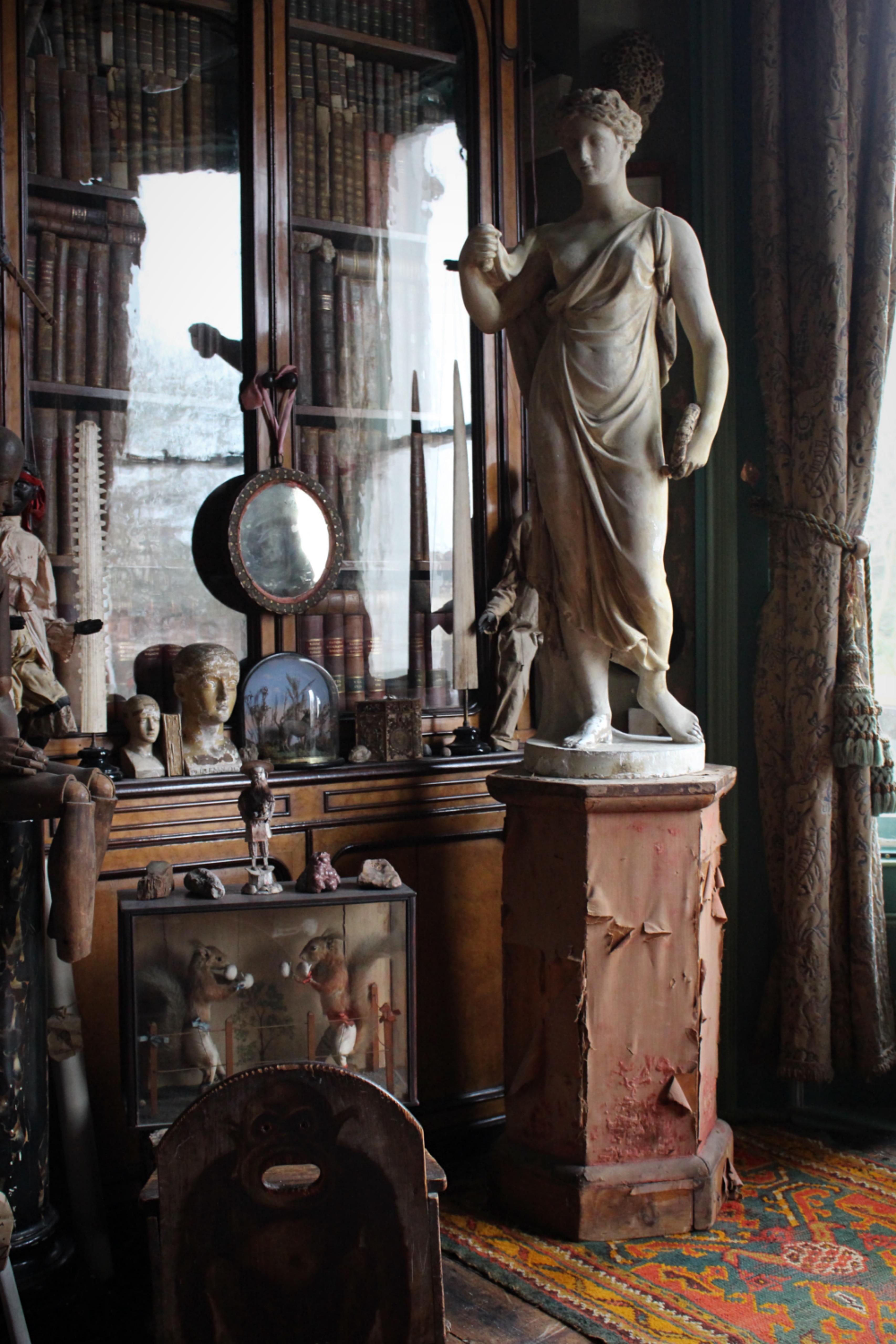 A fine and early to mid 19th century plaster depiction of Flora the Goddess of Spring, possibly by Humphrey Hooper

Flora, the Roman goddess of spring, through the chaplet of flowers that she wears in her hair and the wreath of flowers held in her