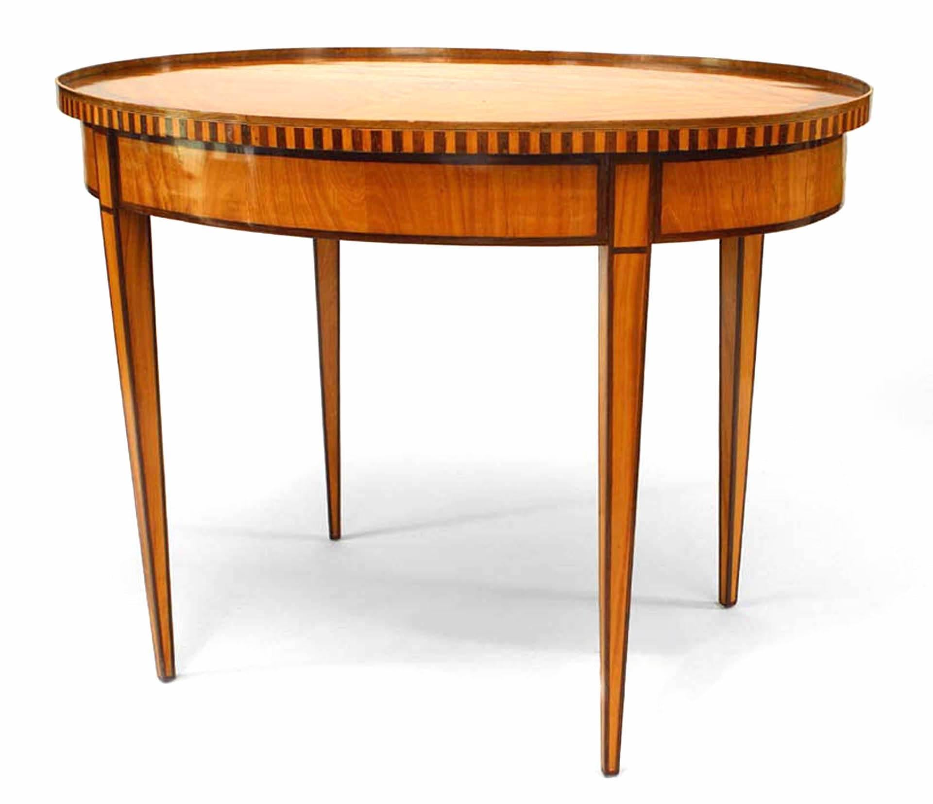 Continental Dutch (18/19th Century) oval satinwood and rosewood inlaid 4 legged center table with gallery and inlaid medallion center.

