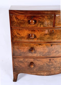 Early 19th Century English Flame Mahogany Bow Fronted Chest of Drawers