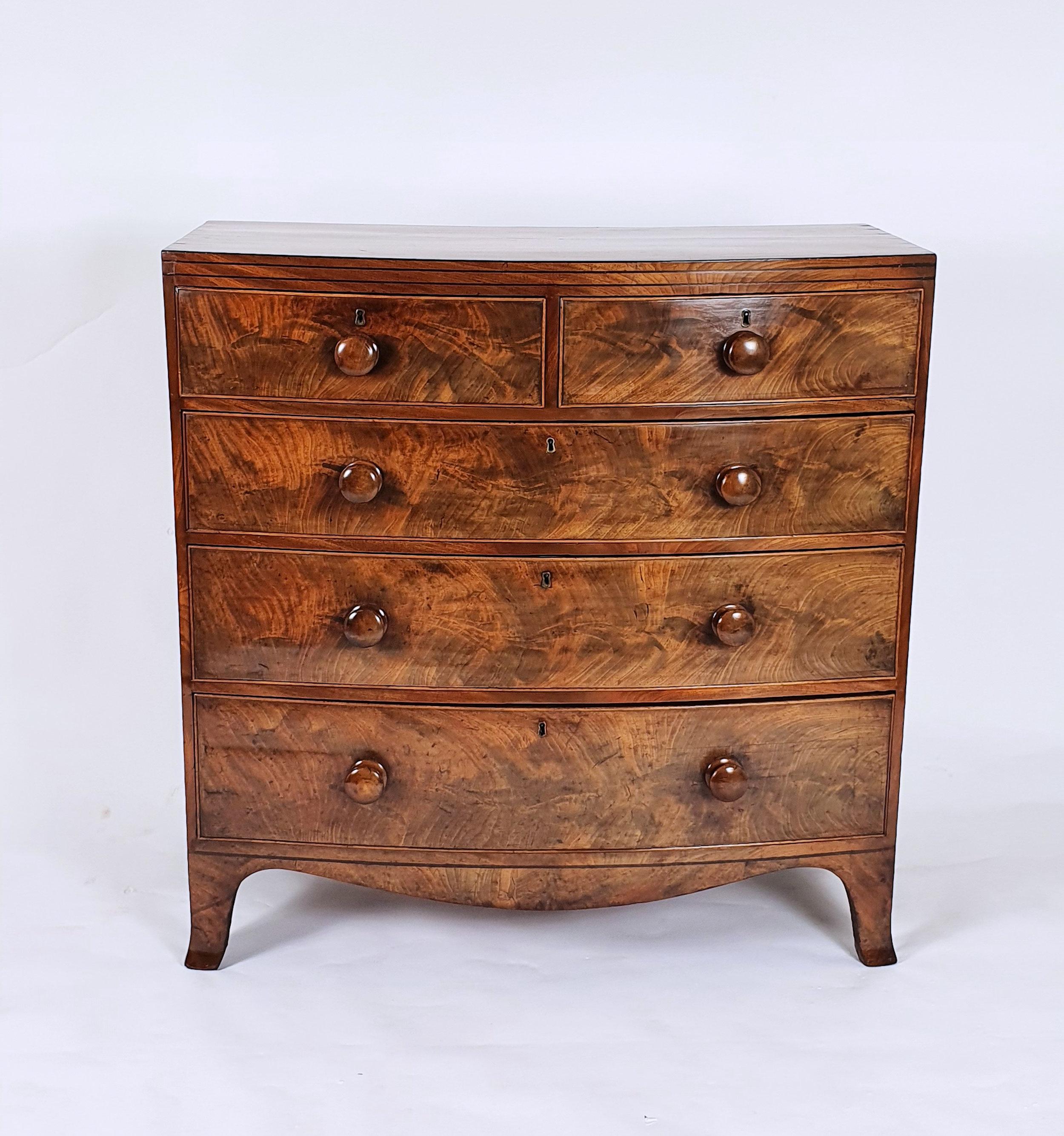 British Early 19th Century English Flame Mahogany Bow Fronted Chest of Drawers
