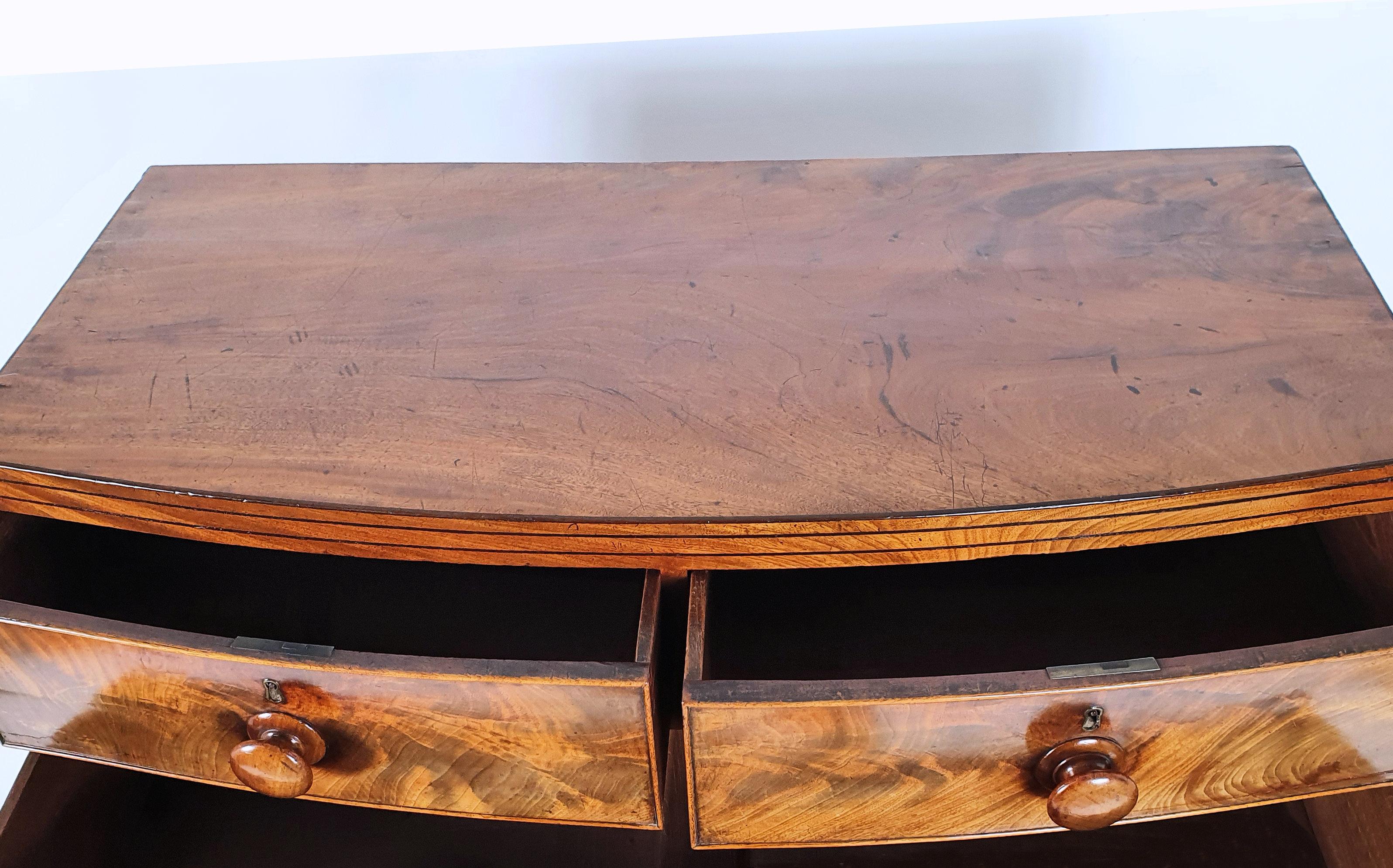 Early 19th Century English Flame Mahogany Bow Fronted Chest of Drawers 1