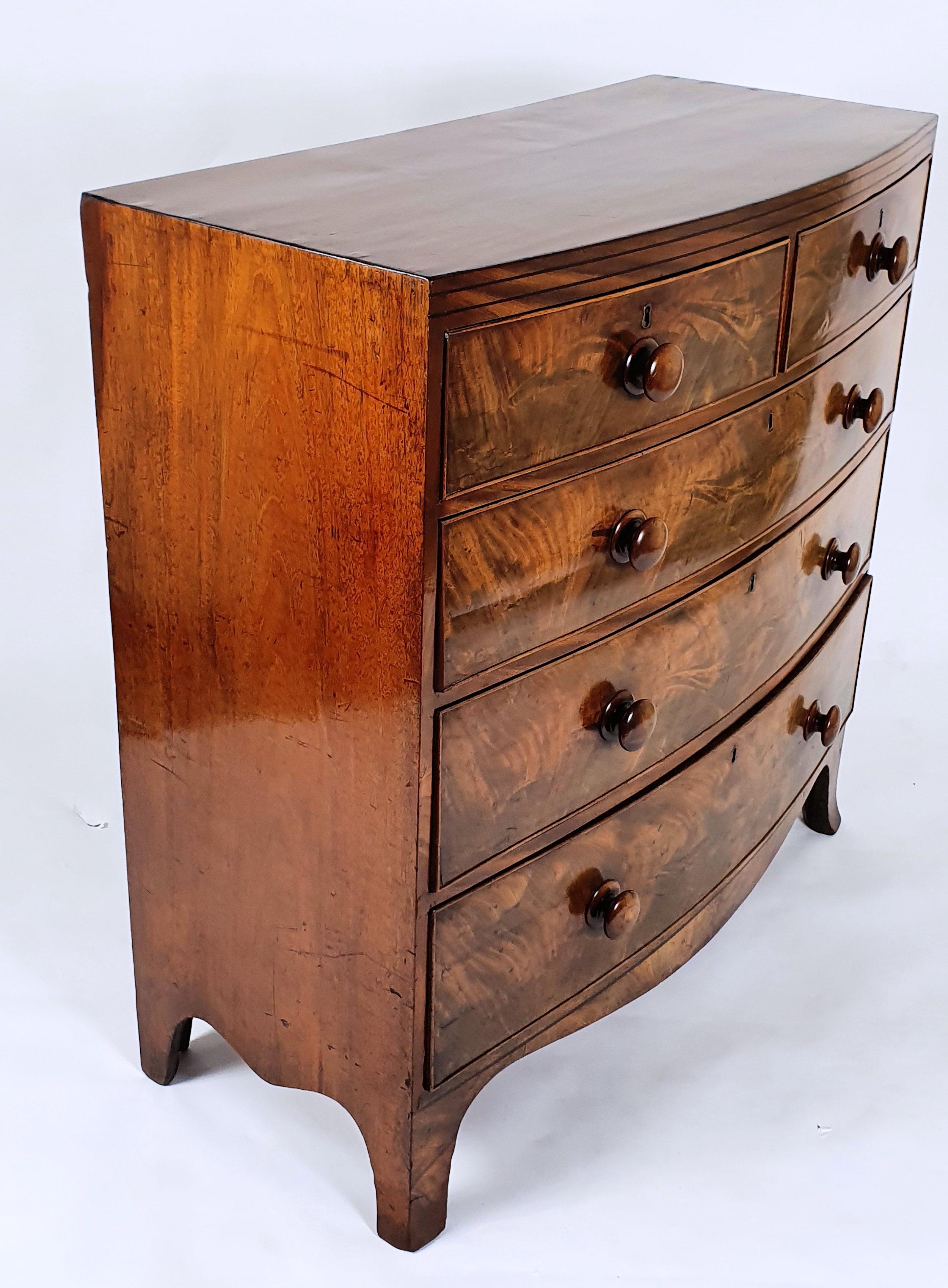 Early 19th Century English Flame Mahogany Bow Fronted Chest of Drawers 4