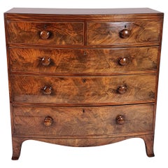 Early 19th Century English Flame Mahogany Bow Fronted Chest of Drawers