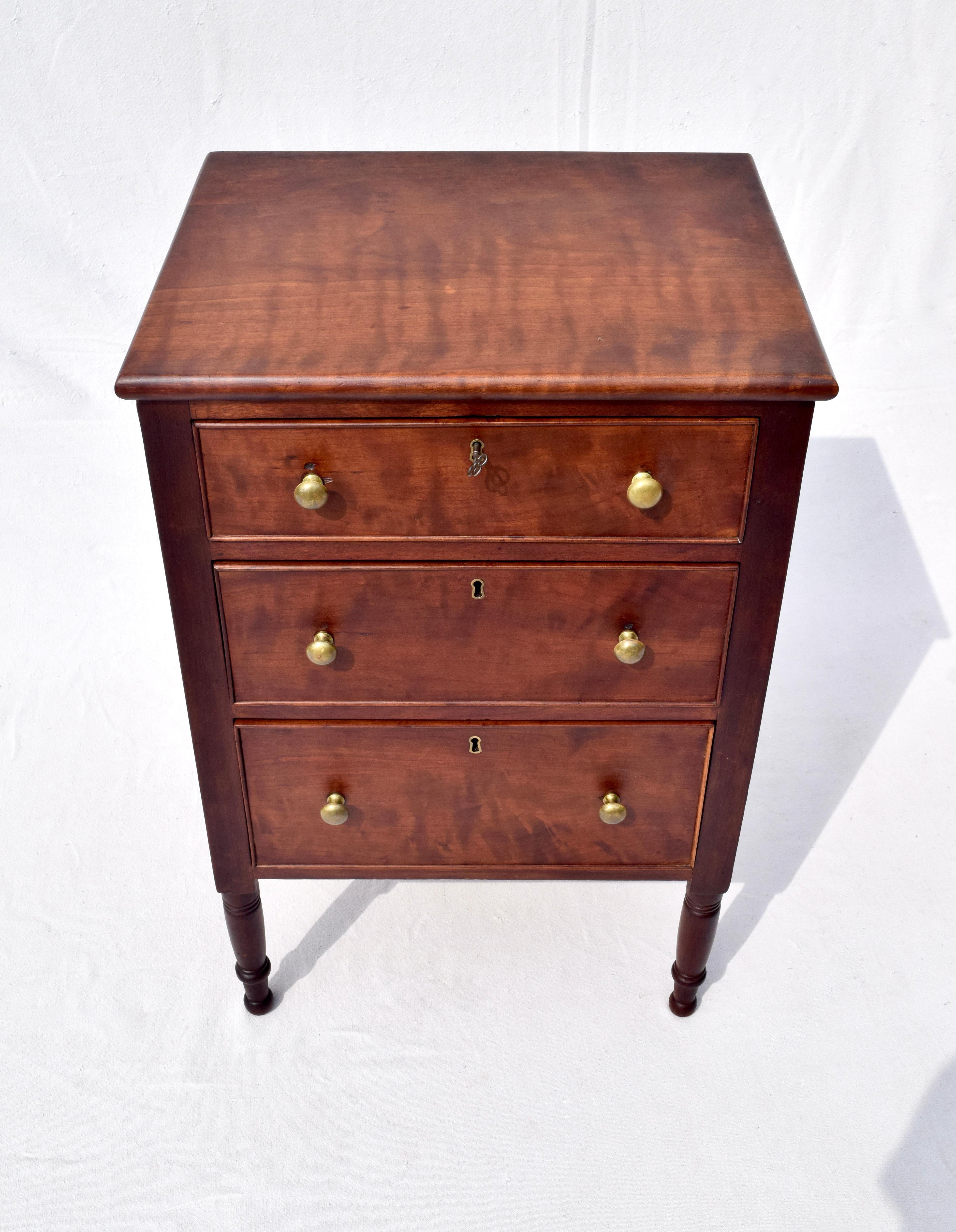 An early 19th c. Federal period Sheraton style chest of three dovetailed drawers with key. Refinished with original working locks. Unique in size & design for versatile uses & placement.