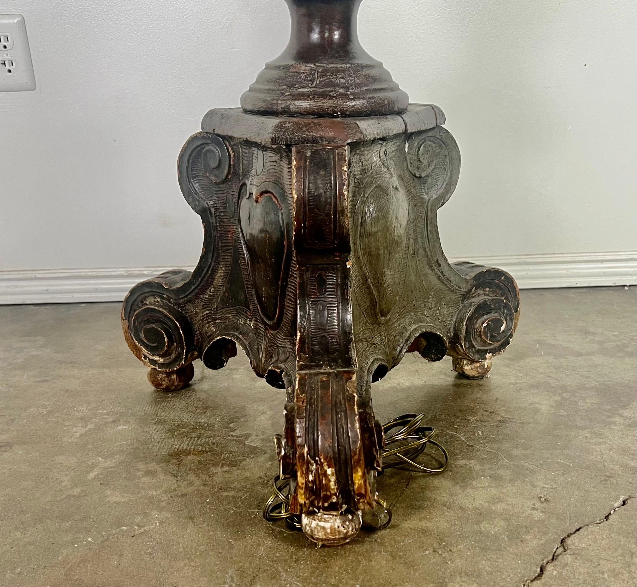 19th C. Italian walnut turned and carved standing lamp.  The lamp has a tripod base and has a carved heart on each side.  The lamp is wired and in working condition.