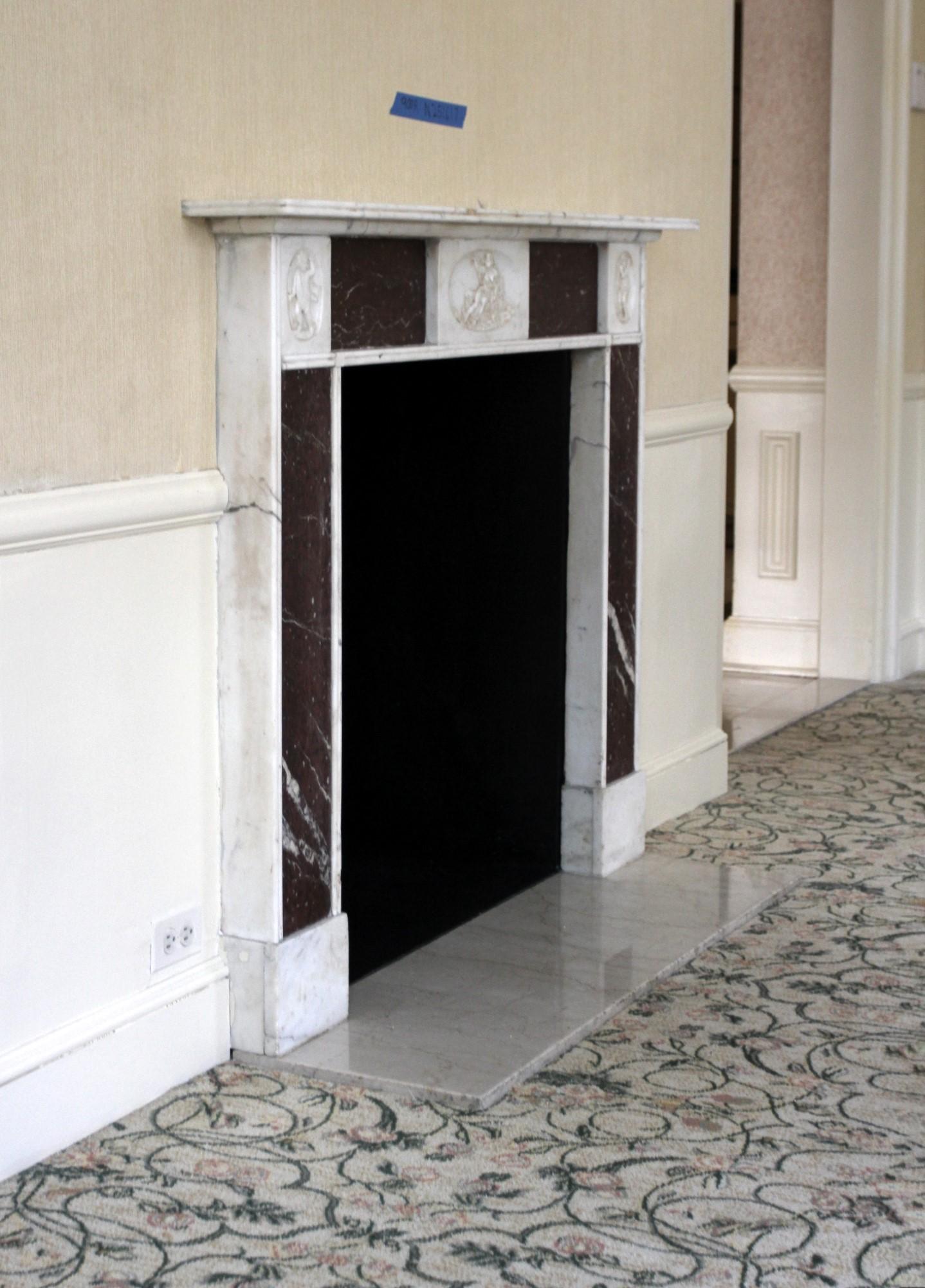 19th century English Regency marble mantel. Part of a group of hand carved antique mantels imported from Europe and installed in the NYC Waldorf Astoria Hotel on Park Ave prior to it's opening in 1931. This mantel was original to suite R of the 9th