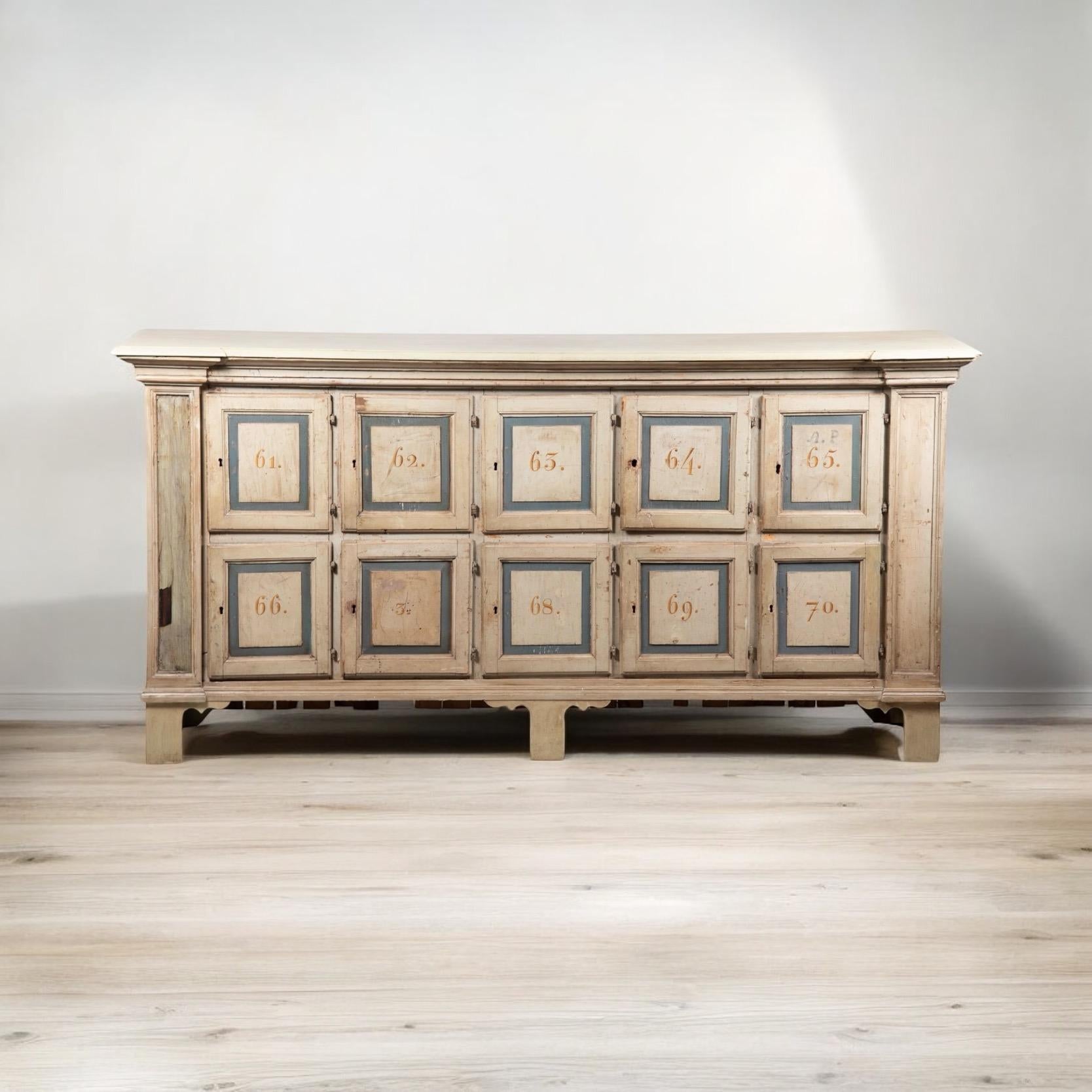This is a wonderful piece with a statement making size! This is an early American Rustic apothecary cabinet. It is hand painted and carved . It dates to the early part of the 19th century and possibly even earlier. More photos to come.

Shipping is