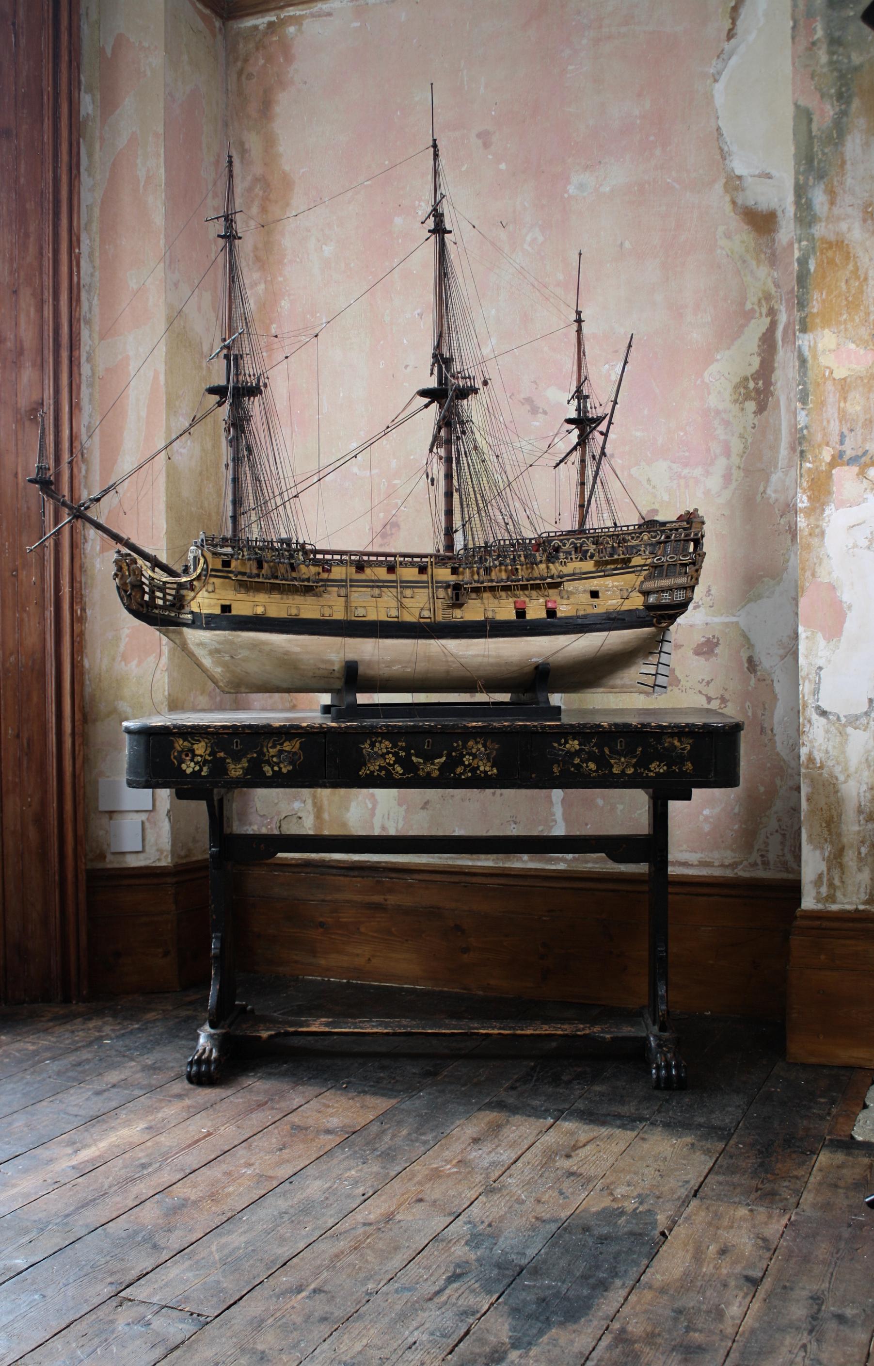 A scarce 1:48 scale admiralty board model of the 100 gun first rate ship of the line Royal William as result to the 1719 establishment in totally untouched original condition.

The hull carved below the ebonised main wale and planked and pinned