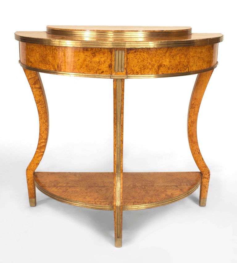Russian Neo-classic (Circa 1800) brass mounted Karelian birch demilune console table with stepped top over an under-tier.

