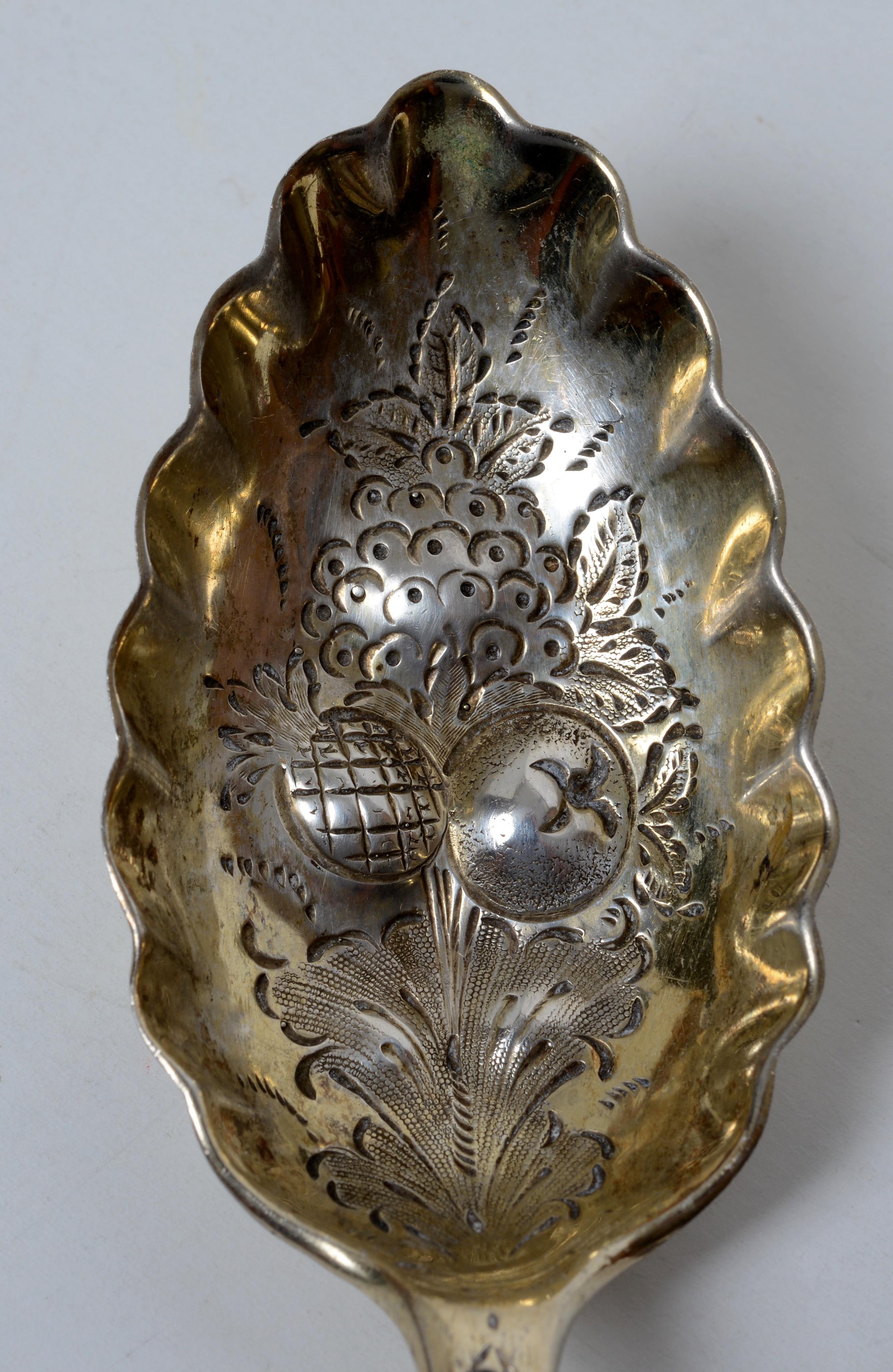 Early 19th c Sterling Berry Spoon with Embossed Gold Washed Wave Edged Bowl. The handle and bowl are beautifully decorated. Berry spoons became popular during the mid-19th century. They were specifically designed to serve fruit and feature elaborate