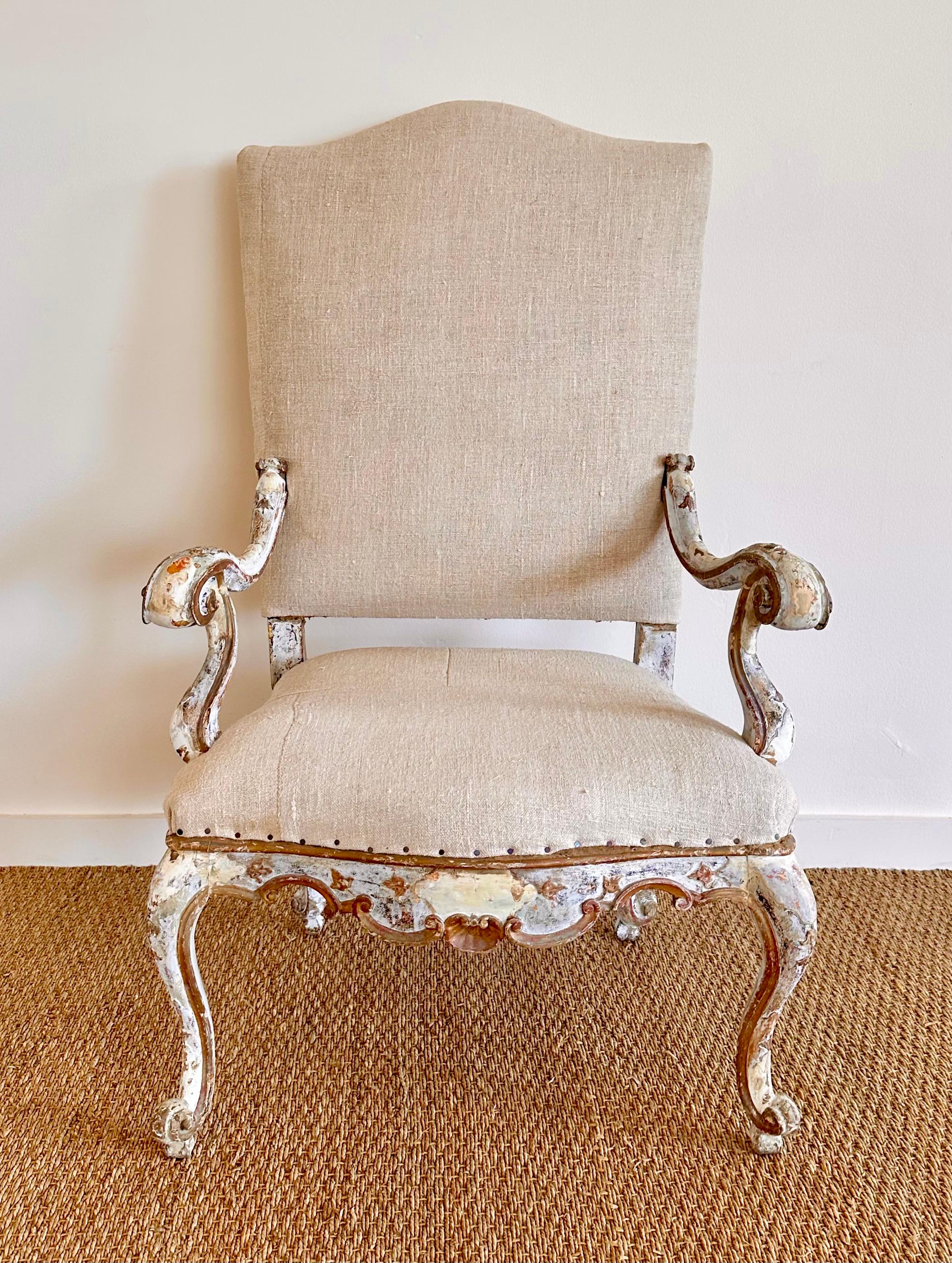 18th C. Tall Italian Armchair with white, pale blue-grey paint , and with gilt detailing.  Original Finish.  
Extremely charming and highly decorative as well as comfortable.  recently upholstered in heavy Belgian linen fabric.  