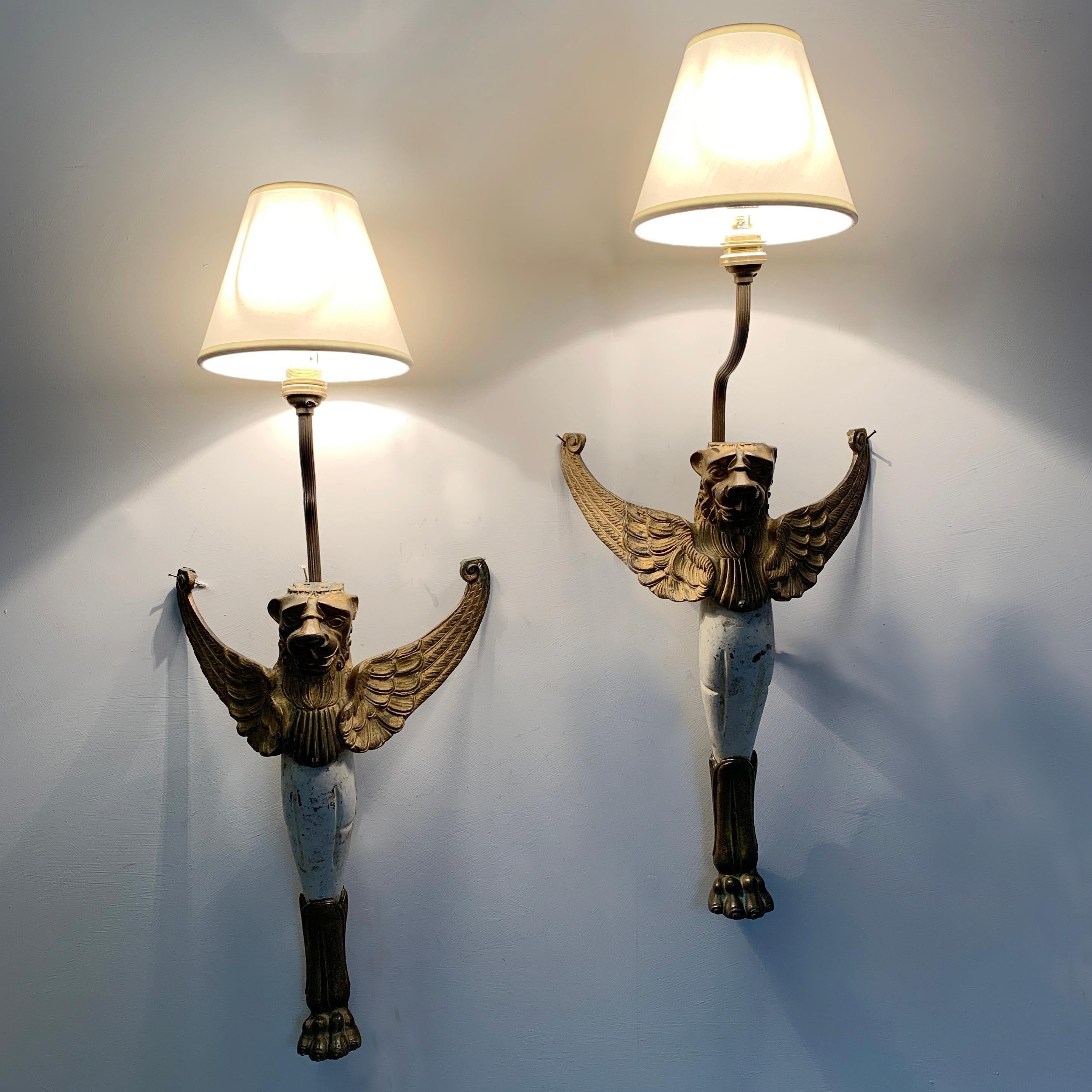 Early 19th century, winged griffin wall lights
Fantastic Georgian griffins, repurposed historically into wall lights
The body is made from wood with solid brass head, wings and feet
The lights have a tall reeded stem holding a single lamp holder