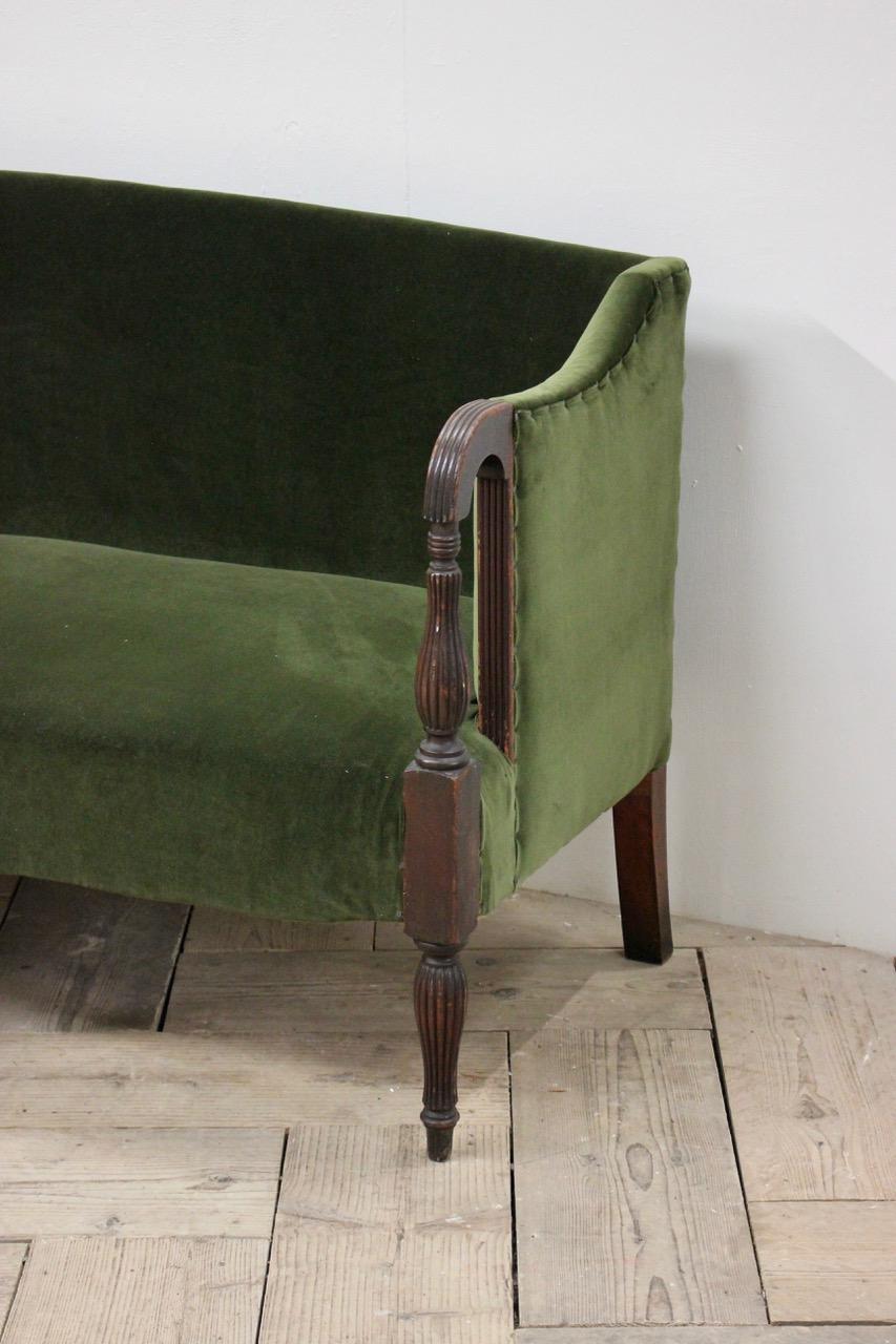 A good quality and of elegant design, early 19th century English Regency period, eight legged mahogany sofa of good proportions, having been reupholstered by us in a green velvet. 

This elegant period sofa will work well in most settings.