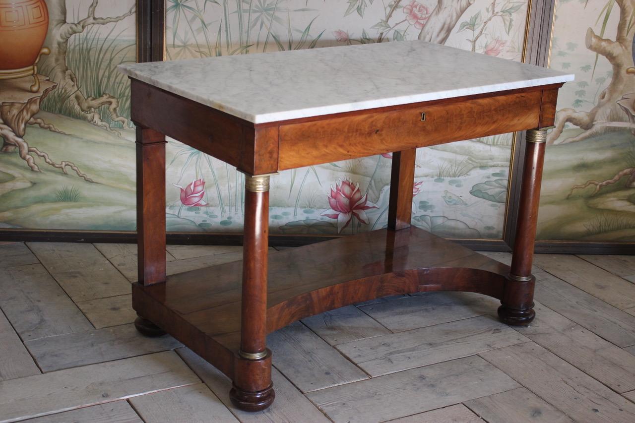 A good quality and of simple lines, early 19th century French single drawer console table with a lovely color and a replaced marble top that will work well in either a Classic or contemporary setting.
France.