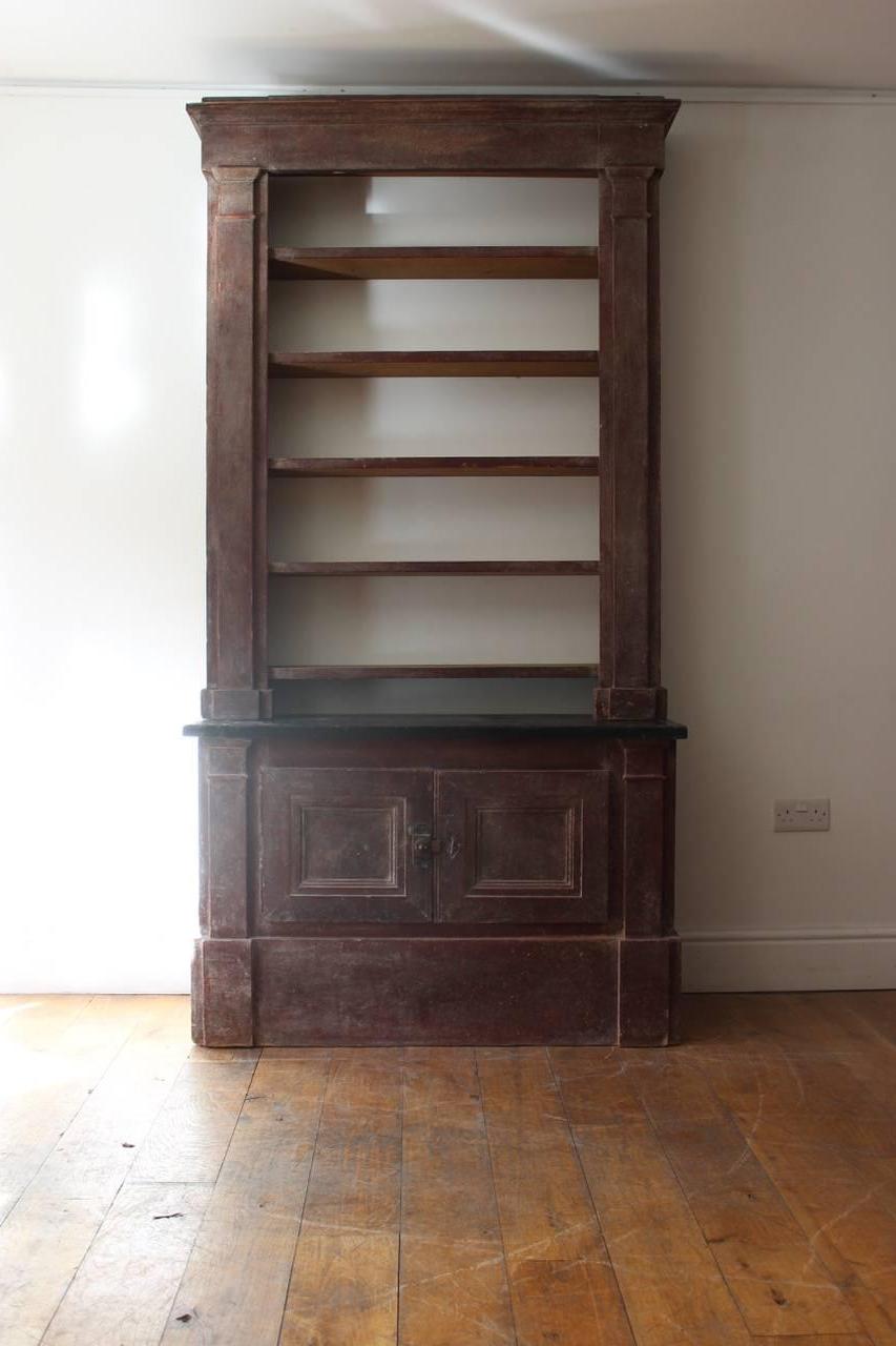 A great early 19th century French Directoire painted bookcase with an open shelved section above a pair of cupboard doors, in original condition, and of wonderful proportions.
  