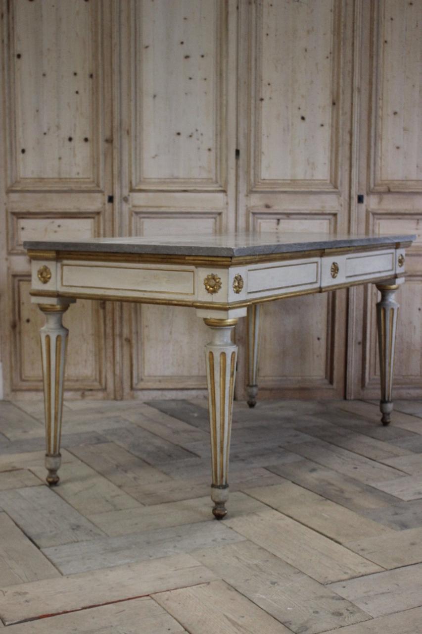 A good quality and of great proportions, early 19th century Italian console table in white paint and gold gilt, in the classical taste with a later marble top.
 