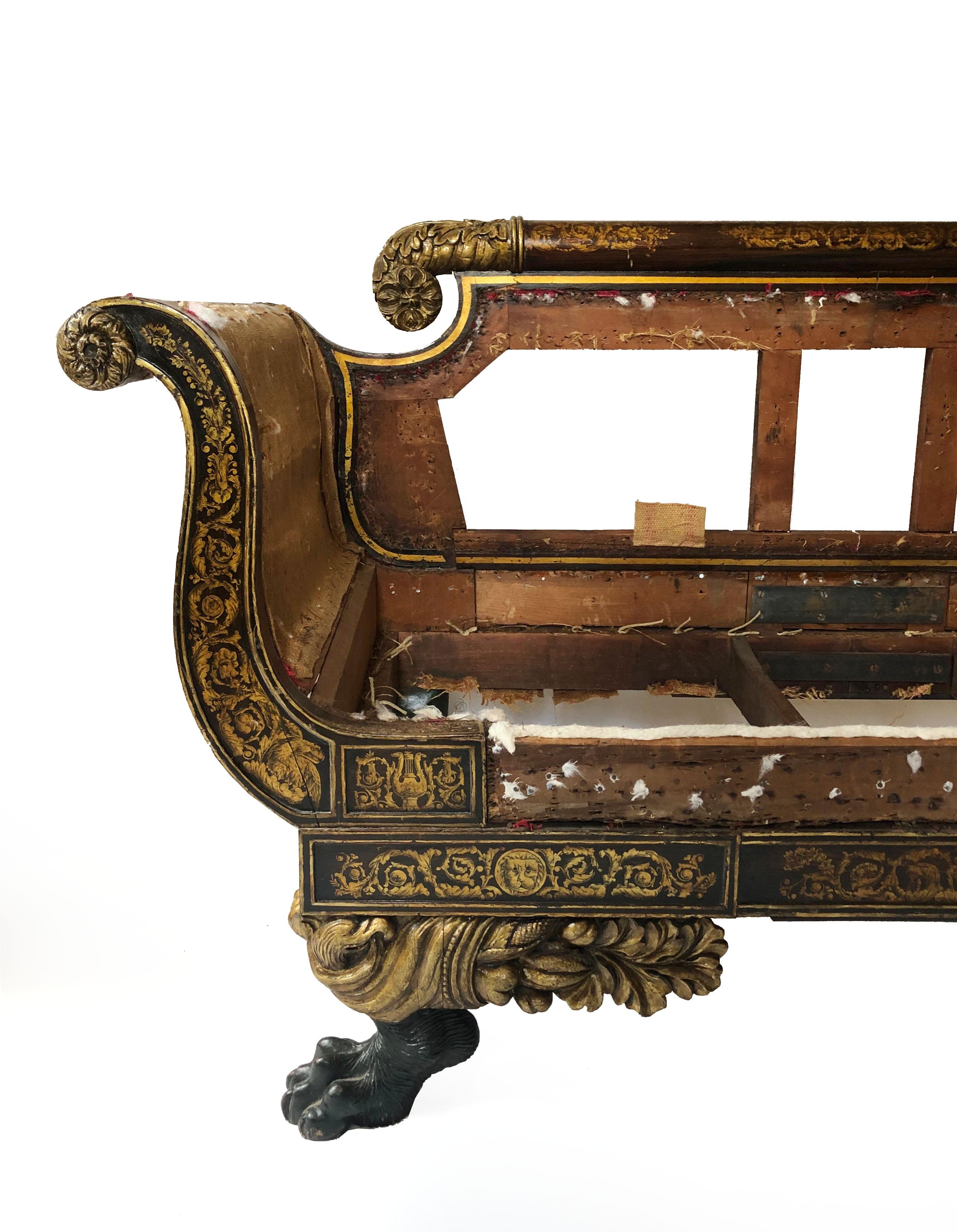 A spectacular New York City parcel-gilt sofa of the highest caliber design and proportions. The grain painted rosewood frame exhibits hand painted designs in gold of acanthus, honeysuckle, eagles, and lions. The carved feet exhibit an eagle's head,