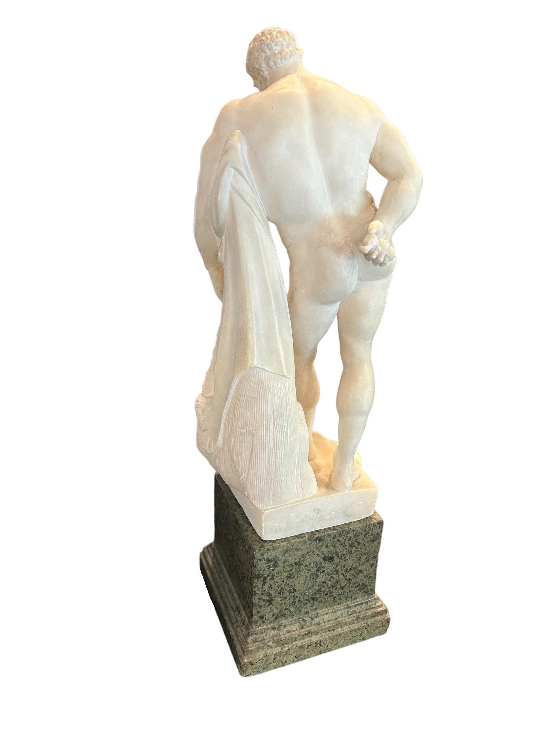 Early 19th century alabaster sculpture from the grand tour period depicting Farnese Hercules with base in verde Alpi marble 