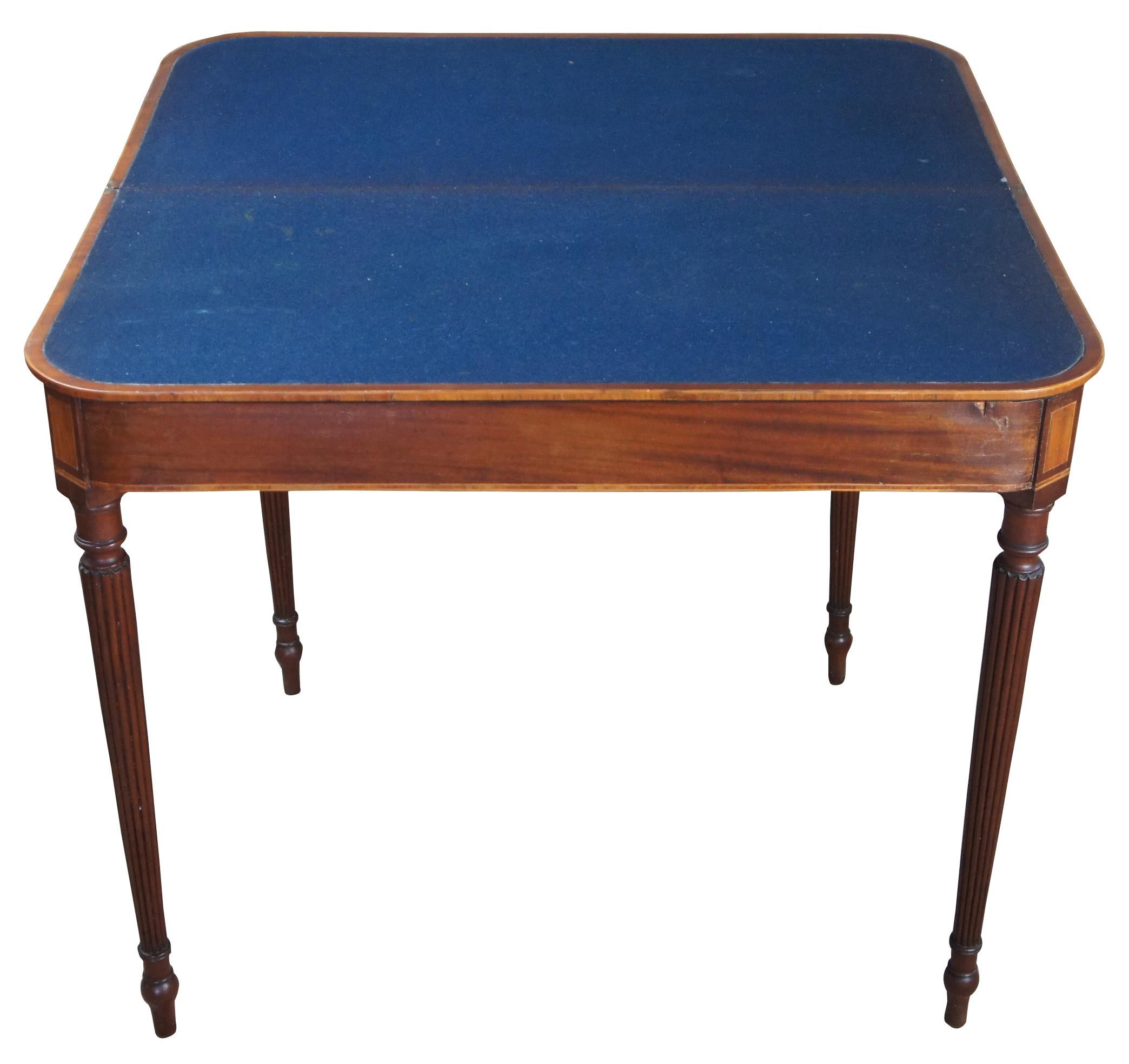 Early 19th century American mahogany Sheraton console game table hall entryway

Mahogany Sheraton entryway console or card table, circa 1810s. Features banding and inlay over fluted and tapered legs Opens to blue baize felt top. Neat gate-leg