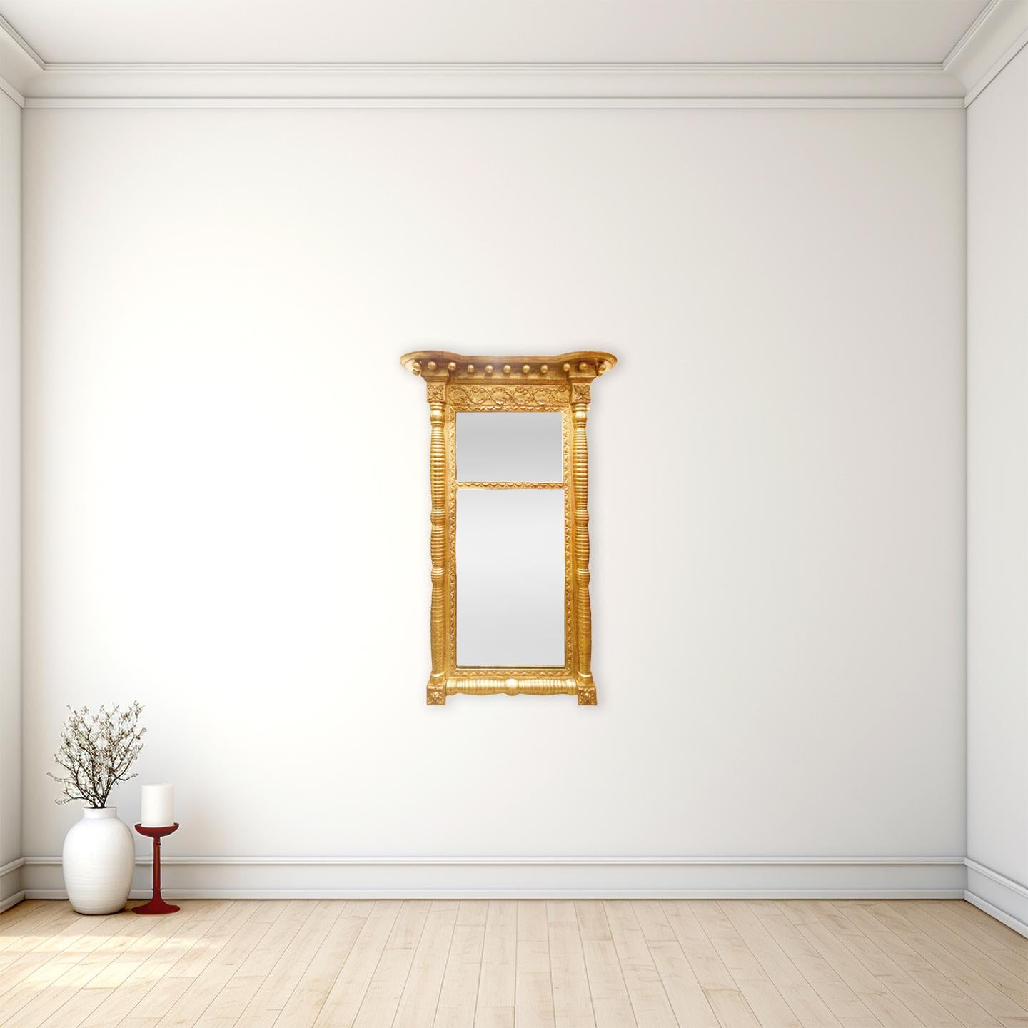 Frühes 19. Jahrhundert Amerikanischer Sheraton Antiker Giltwood Pier Spiegel

Anonym
Vereinigte Staaten von Amerika, wahrscheinlich in Neuengland; ca. 1820
Giltwood, Glas

Ungefähre Größe: 51 (H) x 39,5 (B) x 3 (T) Zoll.

Ein hübscher zweiteiliger