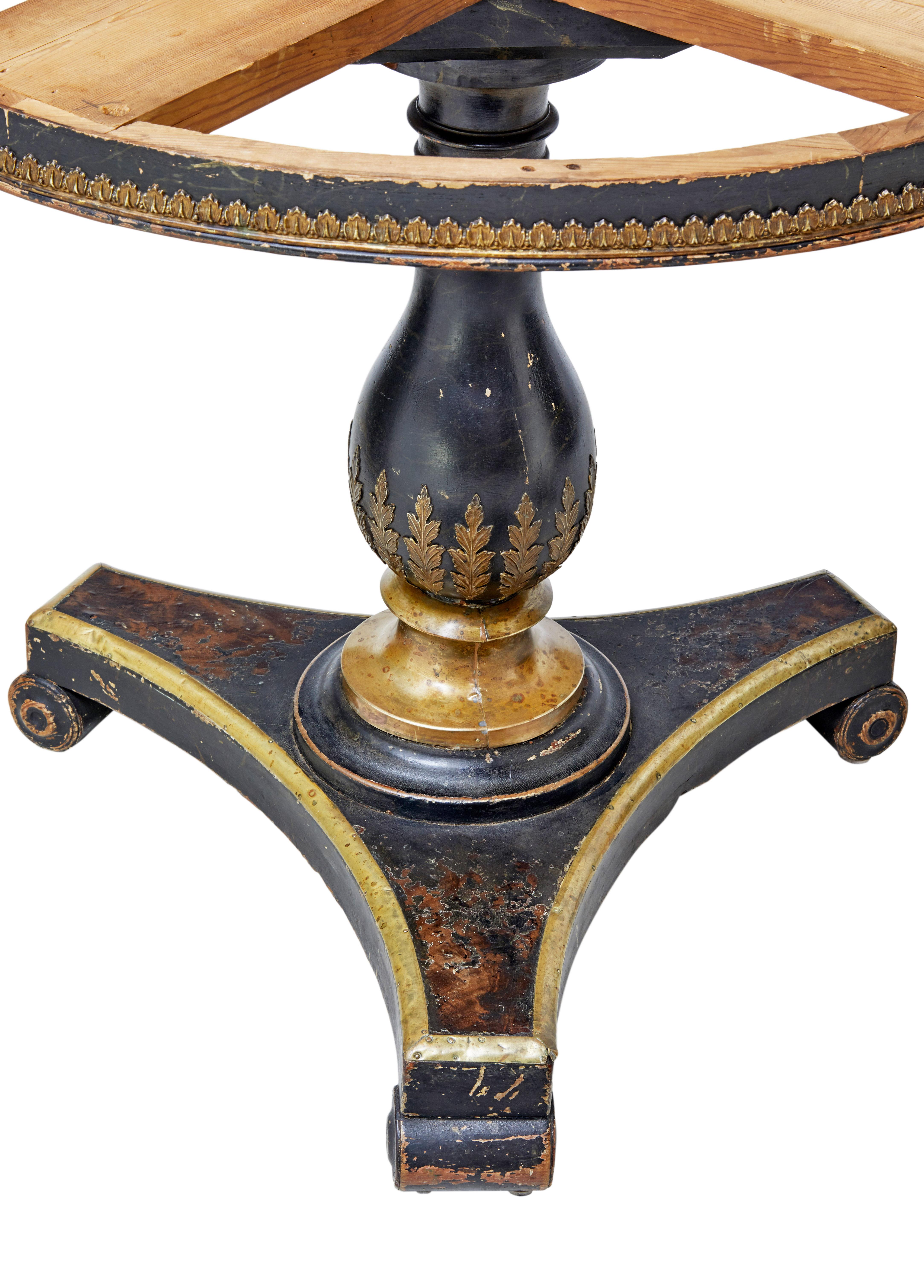 Rare marble top center table circa 1820.

A mahogany center table very much in the taste of brighton pavillion. With later 19th century ebonized brass decoration to the stem and base. Standing on scrolled feet.

Original bull nose marble top
