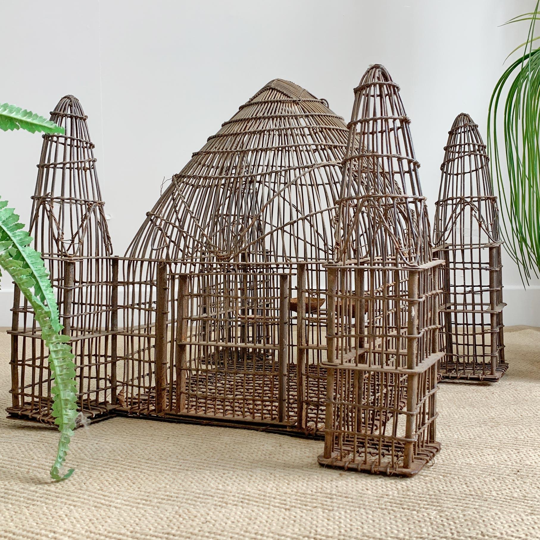 Early 19th century, Anglo-Indian iron bird cage. Fabulous temple shaped design with 4 minarets and one large domed central area.
Superb craftsmanship within the ironwork detailing and finishing.
The door has an fine iron bar which slides within an