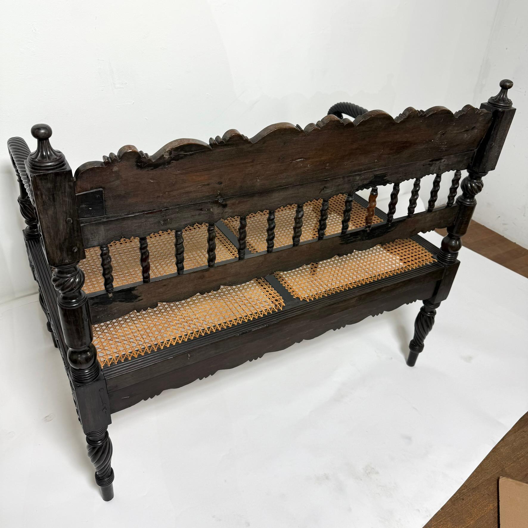 Early 19th Century Antique Anglo Indian Caned Seat Settee in Carved Ebony For Sale 4