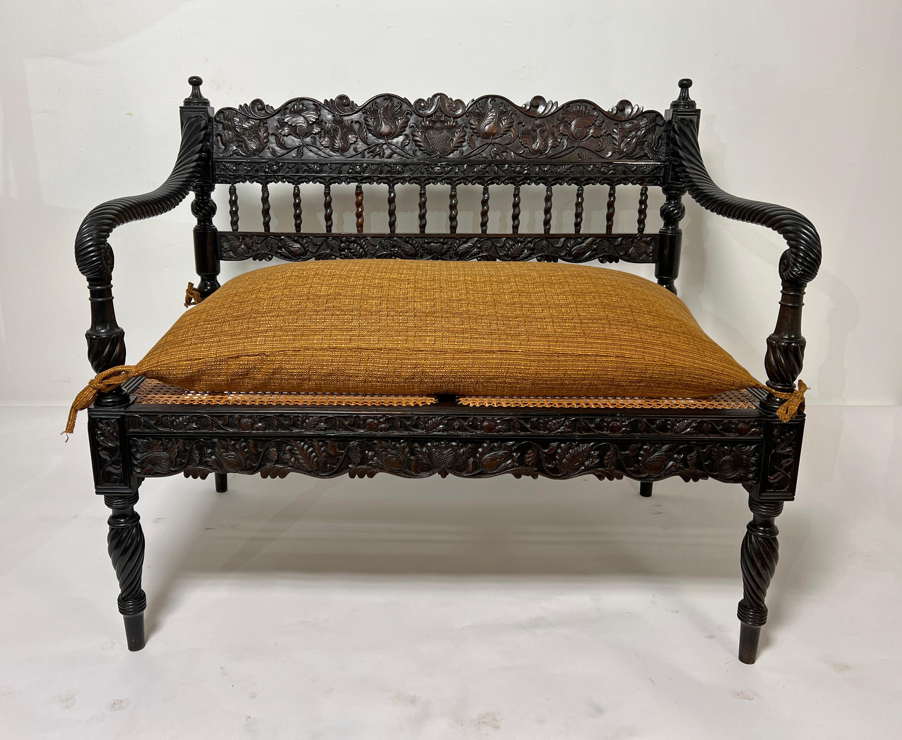 Anglo-Indian Early 19th Century Antique Anglo Indian Caned Seat Settee in Carved Ebony For Sale