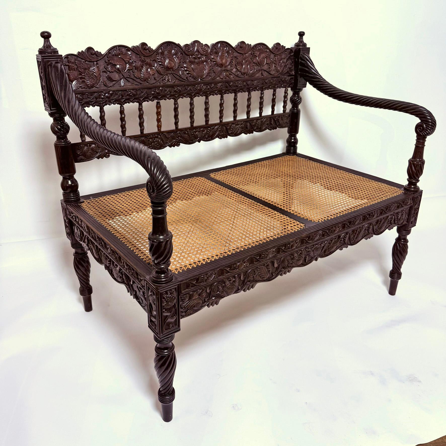 Early 19th Century Antique Anglo Indian Caned Seat Settee in Carved Ebony For Sale 2