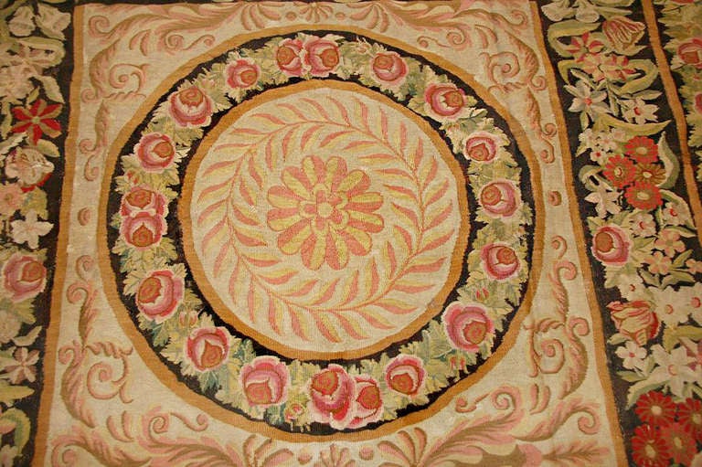 Antique Bessarabian Kilim rug, origin: Romania, circa early 19th century. Size: 8 ft x 11 ft 2 in (2.44 m x 3.4 m)

This elegant antique Bessarabian Kilim displays a stunning Romanian interpretation of the lavish neoclassical designs that ruled