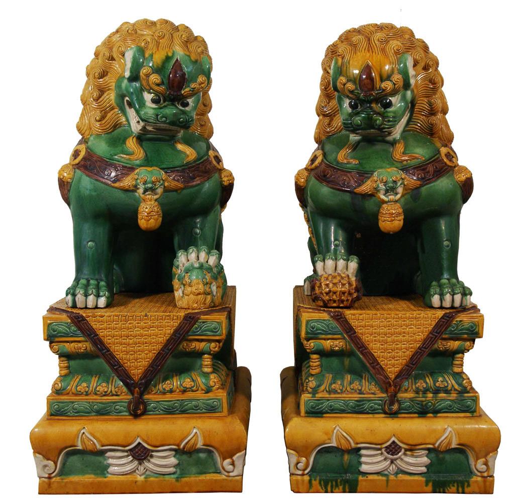 This magnificent Chinese antique colored glaze ceramic lion statuary are hand made and hand carved in Museum quality. According to historical books, lions were introduced into Mainland China firstly as tributes to the Emperors. They are symbols of