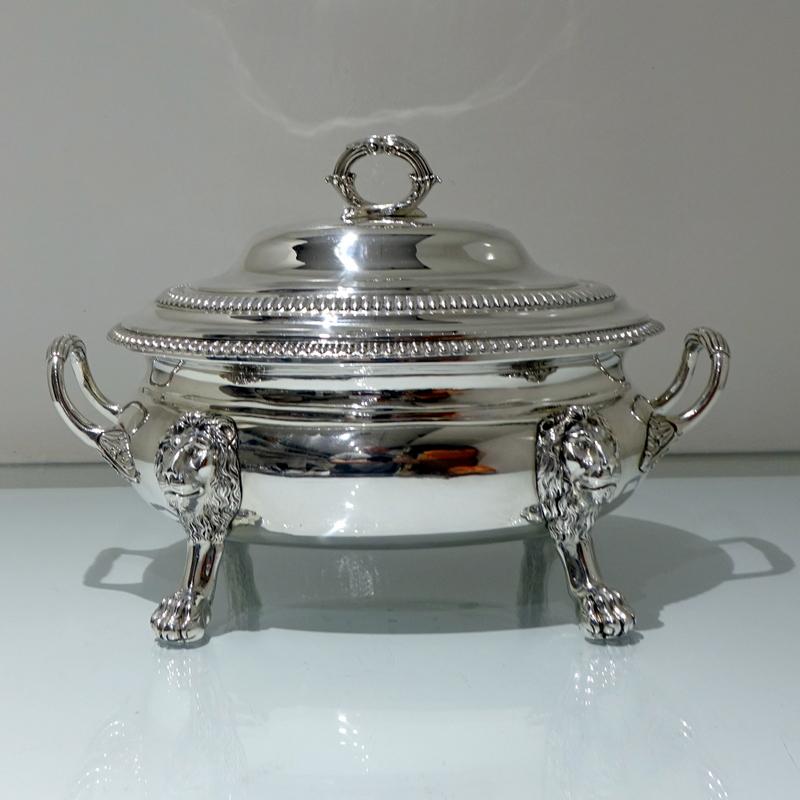 A very good quality and extremely attractive large oval soup tureen standing on four stylish lion mask feet. The body and lid of the tureen have decorative gadroon borders and the two applied handles have elegant floral motifs.

 

Weight: 108