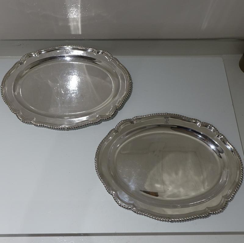 A large pair of 19th century old Sheffield plate meat dishes shaped oval in design with applied gadroon borders for highlights. Both dishes have elegant contemporary crests for importance.

 

Measures: Length 17.25 inches/43.5cm

Width 13