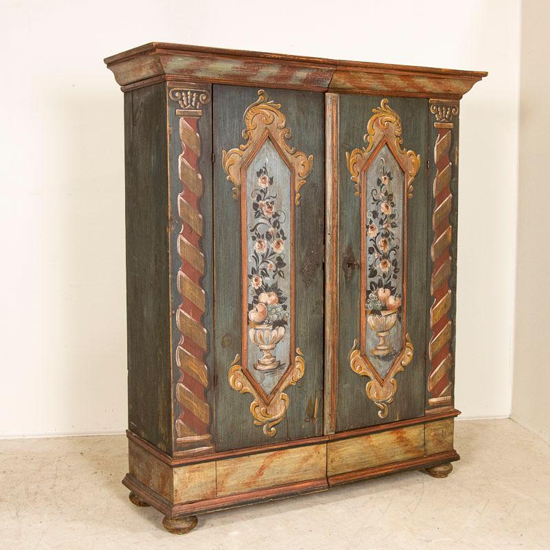 This impressive original painted large armoire or 