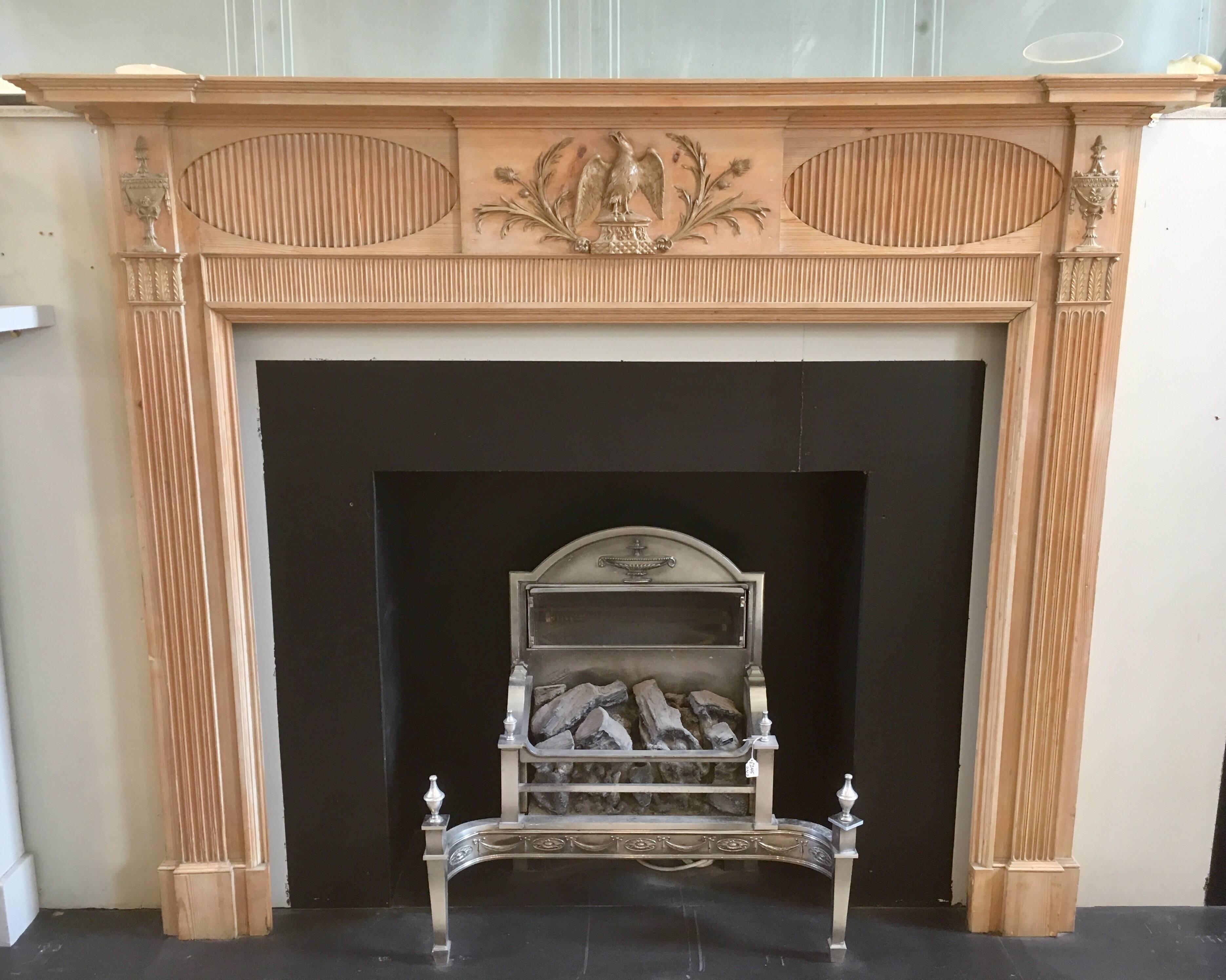 A charming early 19th century Antique Pine & Gesso Georgian timber fireplace surround salvaged from Edinburgh's historical New Town. A breakfront and moulded shelf sits above a a frieze with a central tablet hosting an open eagle with tendrils of