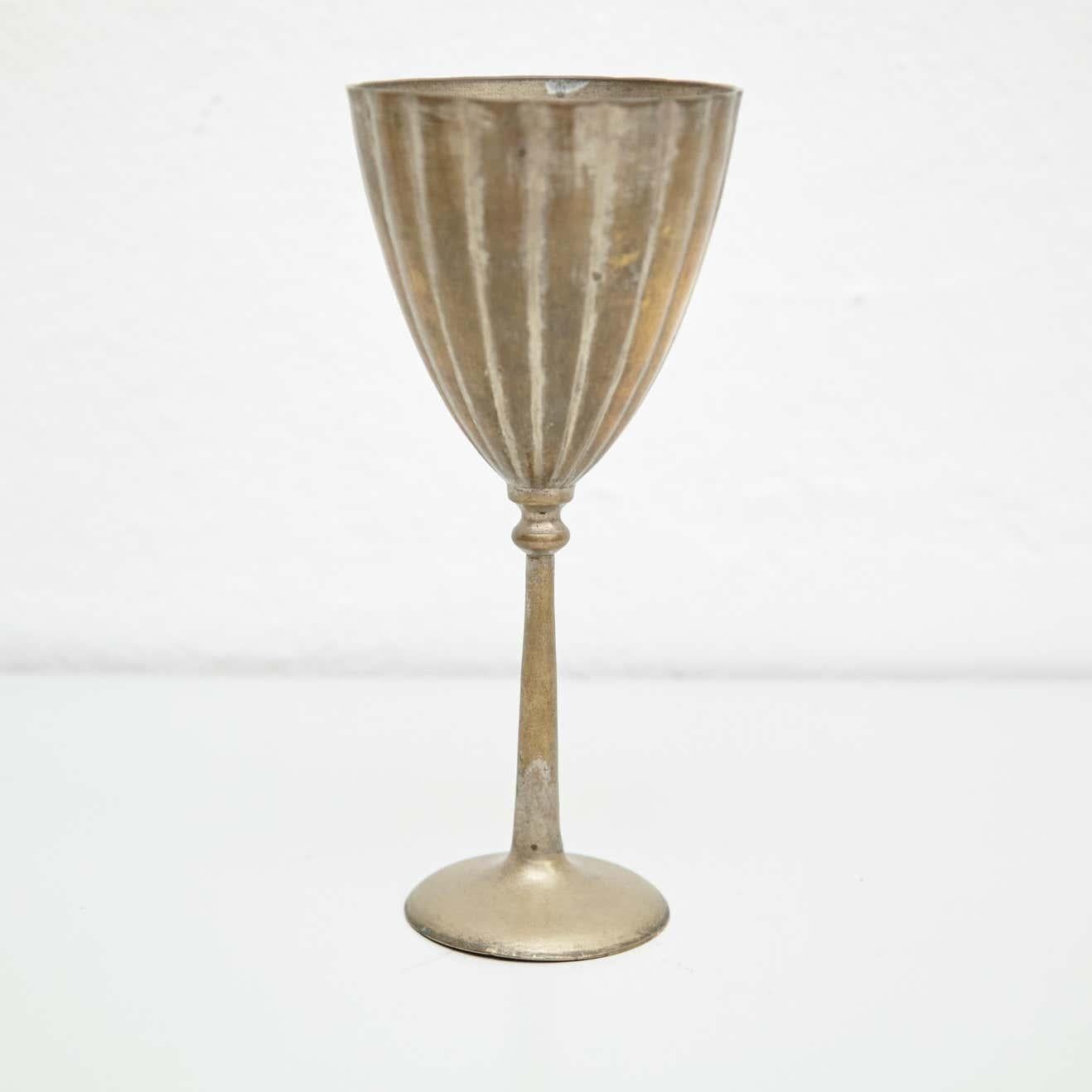 Early 19th century religious bronze chalice by unknown manufacturer, France.  In original condition, with minor wear consistent with age and use, preserving a beautiful patina.  Materials: Bronze  Dimensions: Ø 9.5 cm x H 20.5 cm.