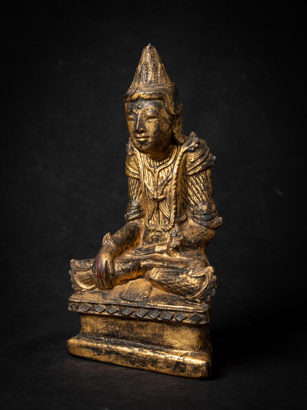 This antique wooden Burmese Shan Buddha statue is a remarkable piece of religious artistry and craftsmanship. Carved from wood, it stands at a height of 29 cm with dimensions of 15.5 cm in width and 8.7 cm in depth. 

The statue belongs to the Shan