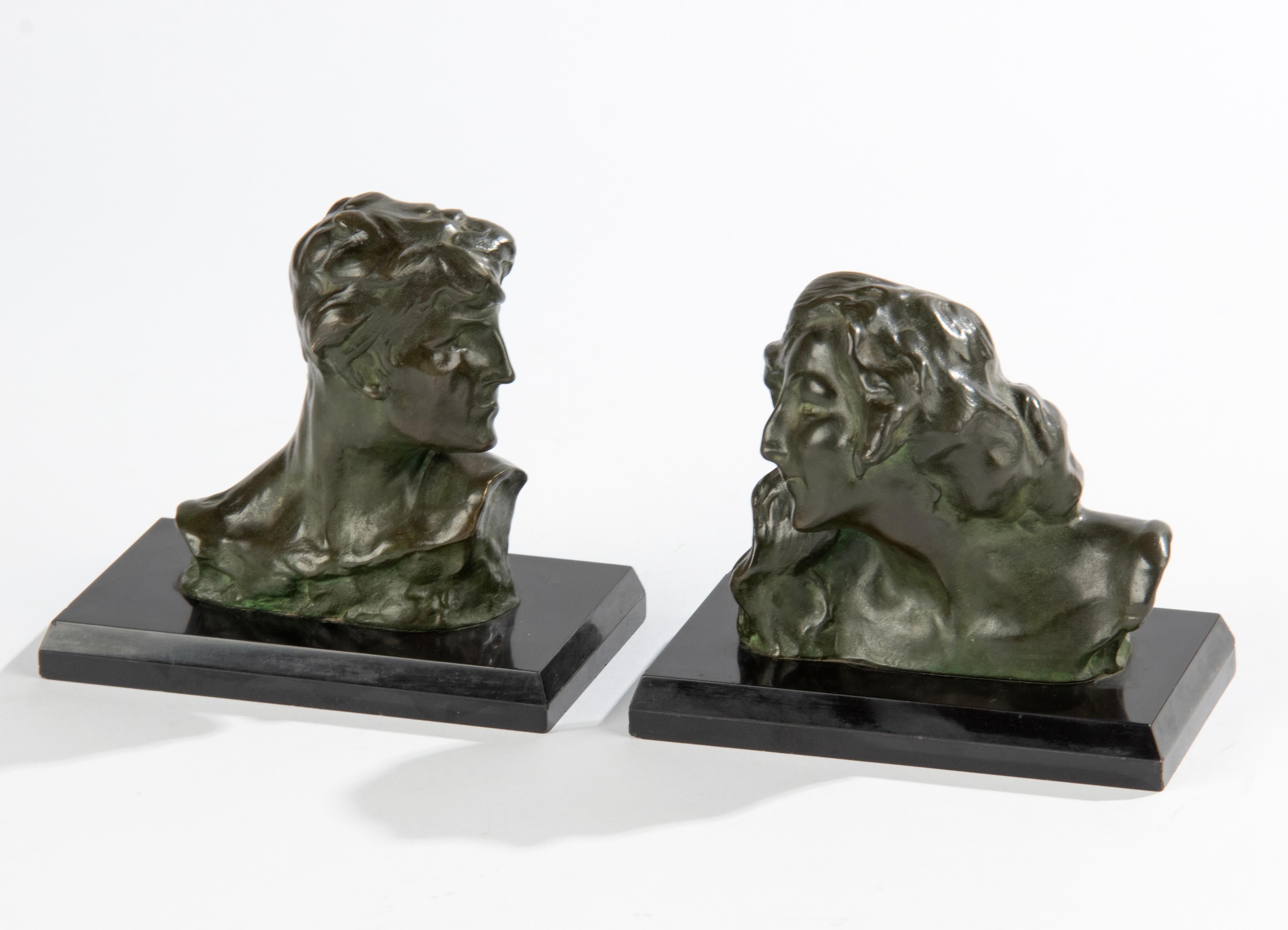 Matching pair of Art Nouveau period bookends or busts. The figurines are made of green patinated bronze, on a Belgian black marble base. The patina on the bronze is in good condition, marble in good condition as well, some tiny chips on the edge,