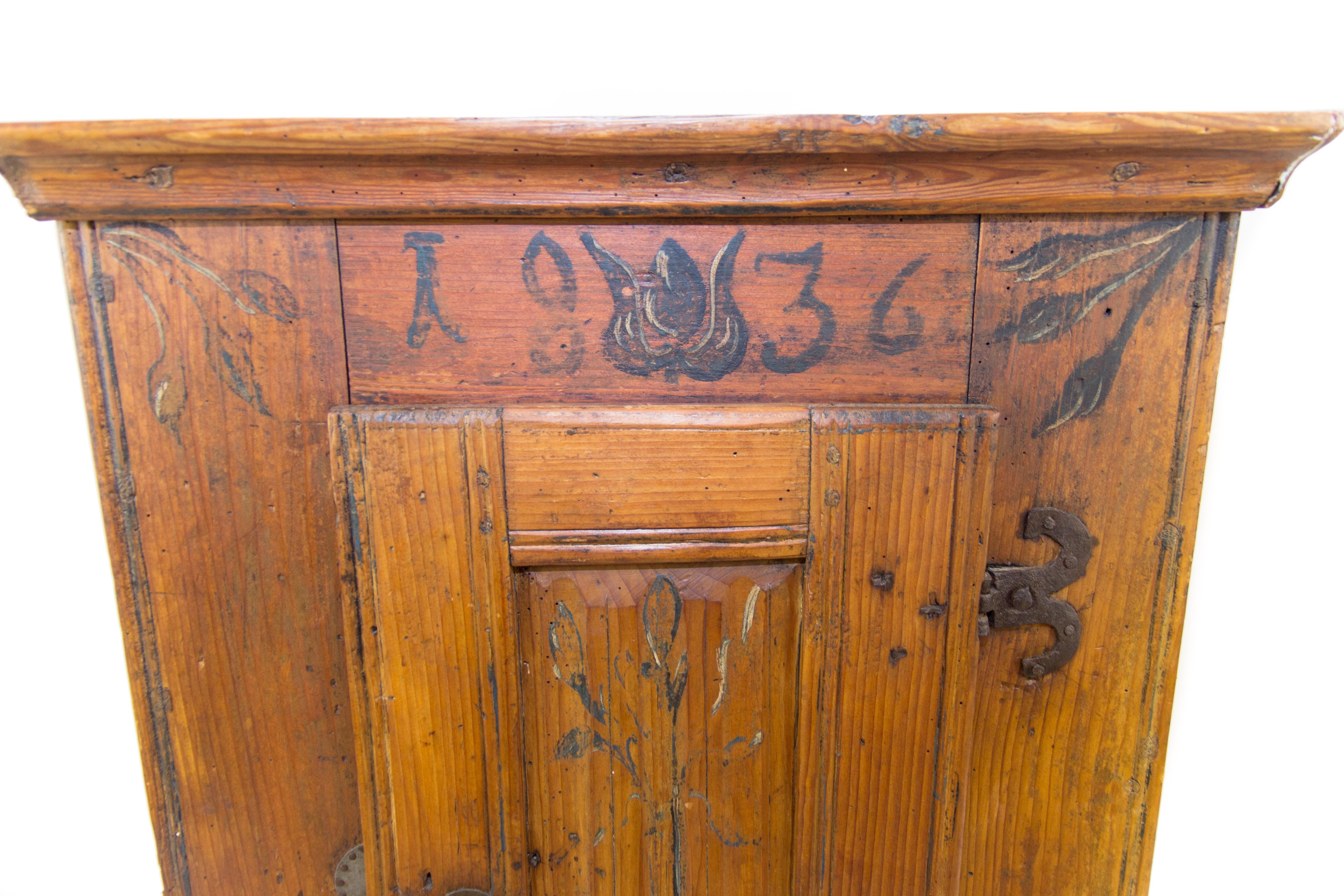Early 19th century country style Baltic pine cabinet, original hand painted decors and dated with 1836. This antique cabinet is fully functional. It shows signs of age - light scratches and wear from previous use but remains in a good condition.