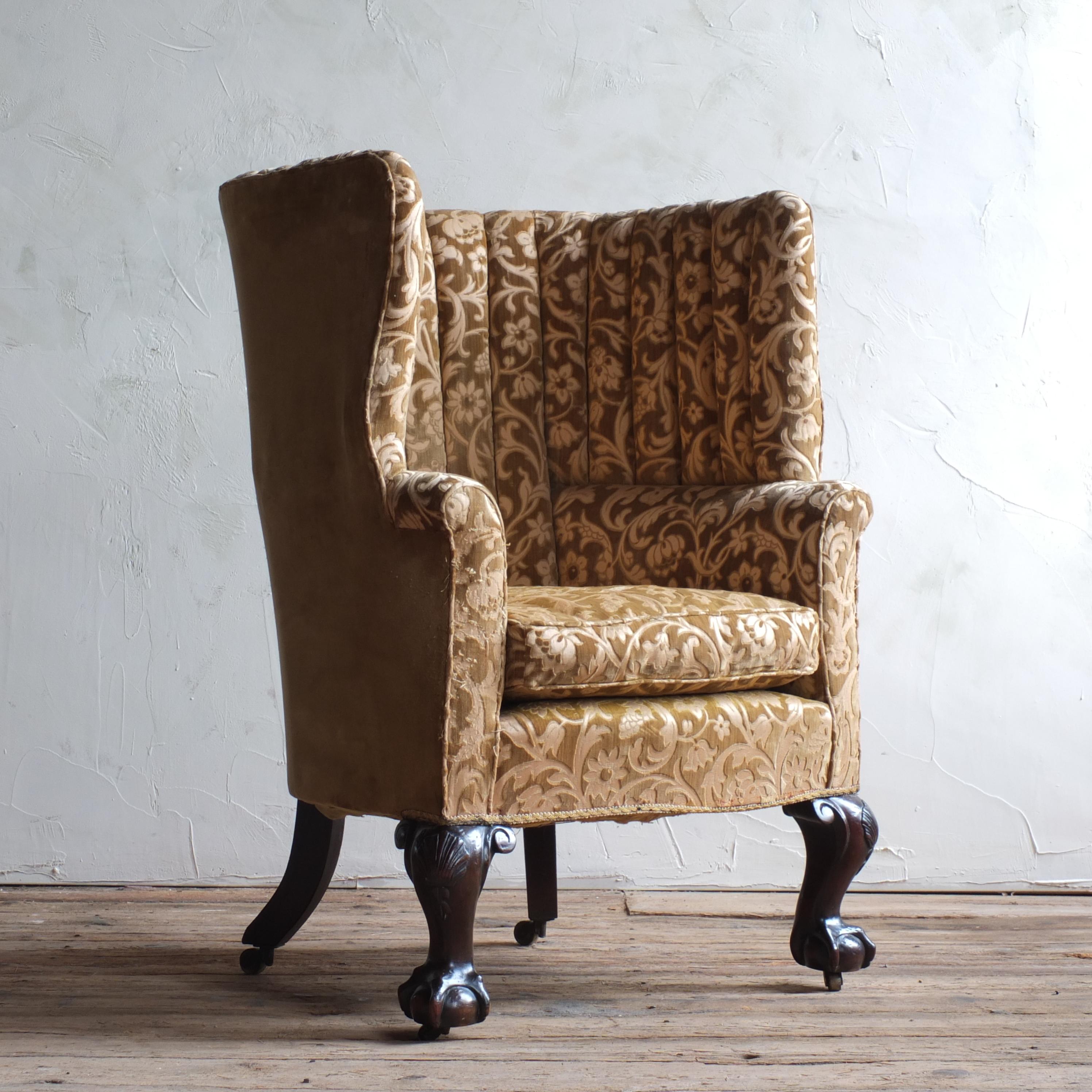 An English 19th century barrel back armchair of country house proportions. Raise on carved ball and claw mahogany legs to the front and out swept to the rear, all with brass casters.

Slight movement in the frame as can be expected with a chair of
